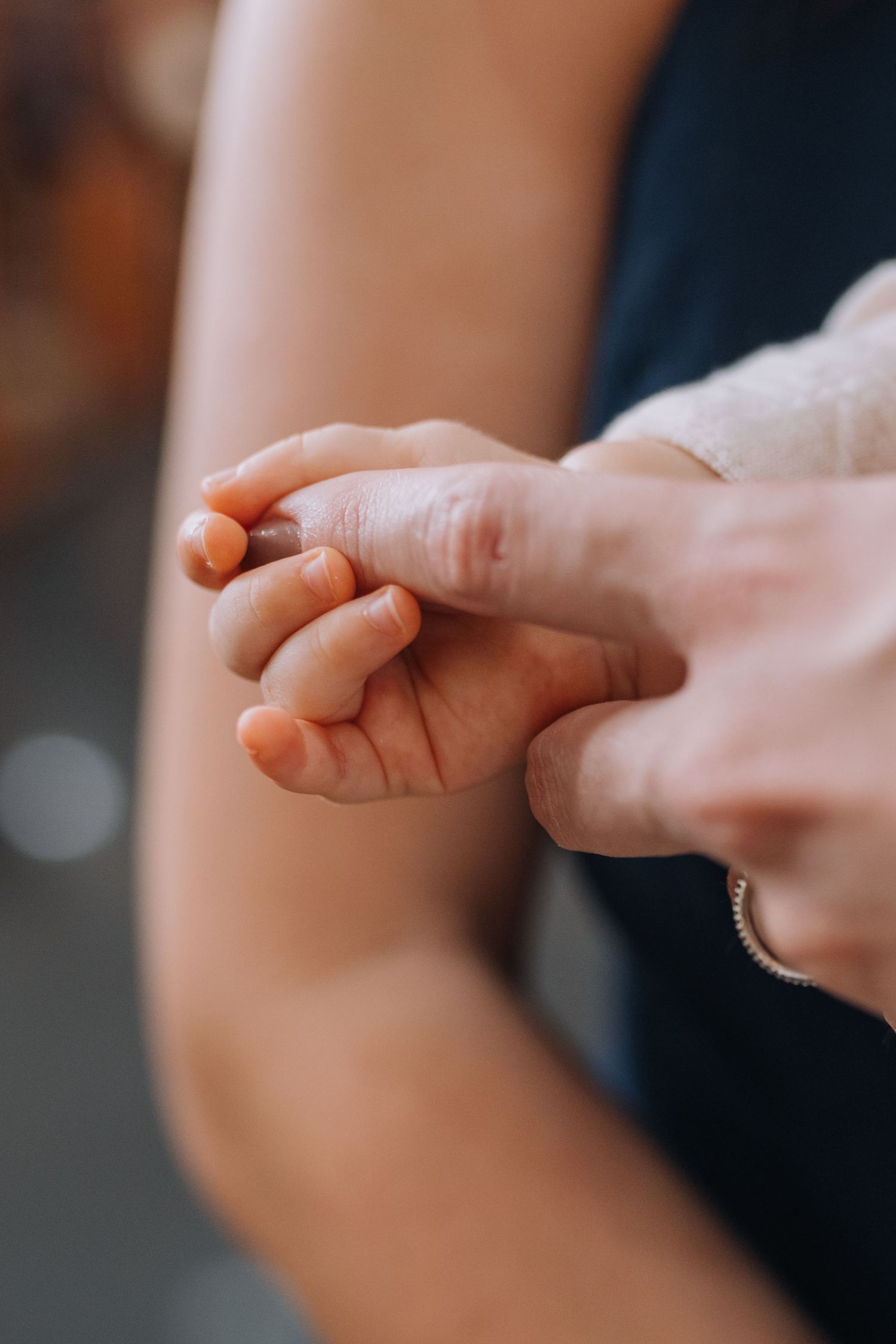 Close-up shots of hands holding each other in sequence.