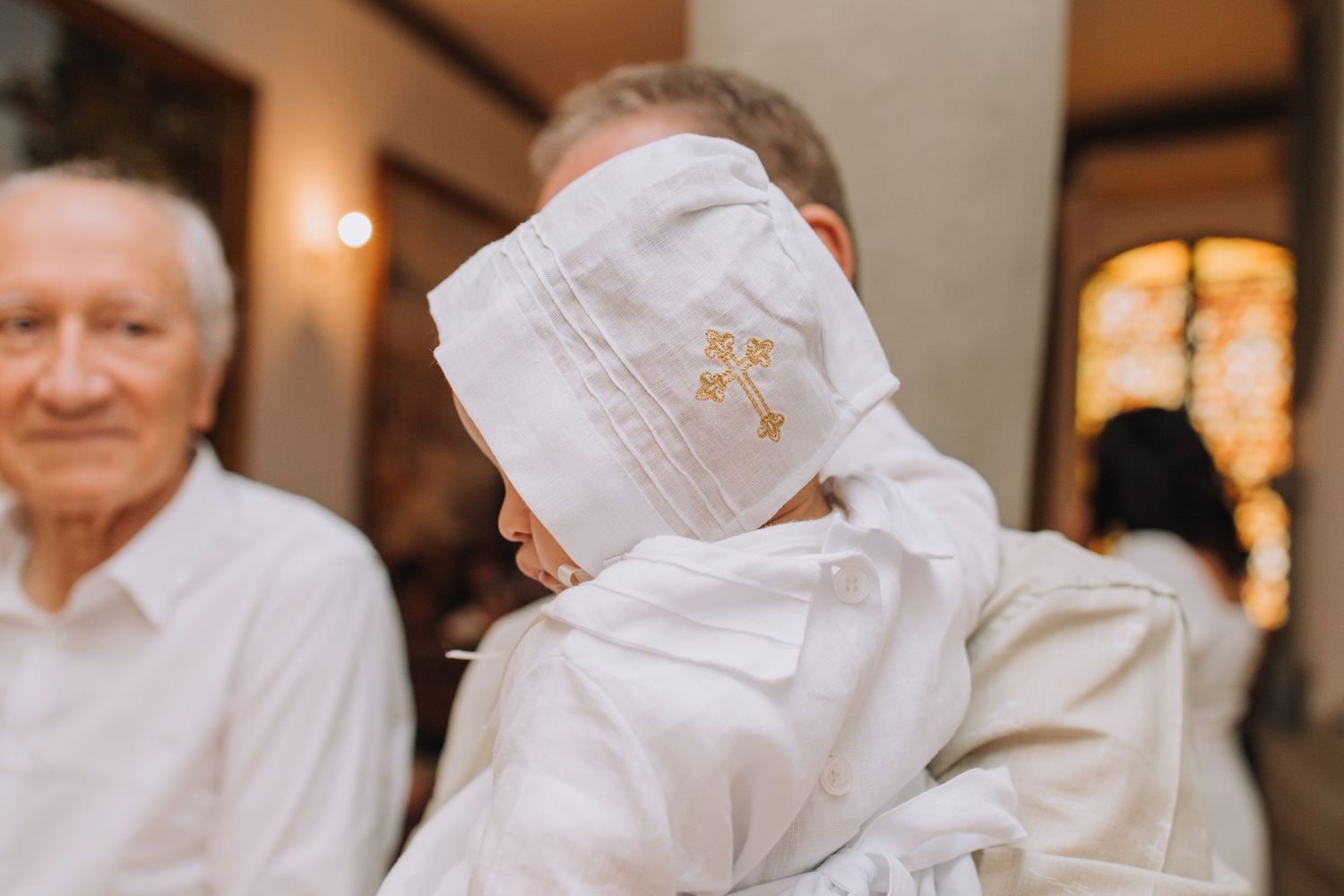 Group photo of people dressed in white gathered for a special celebration.