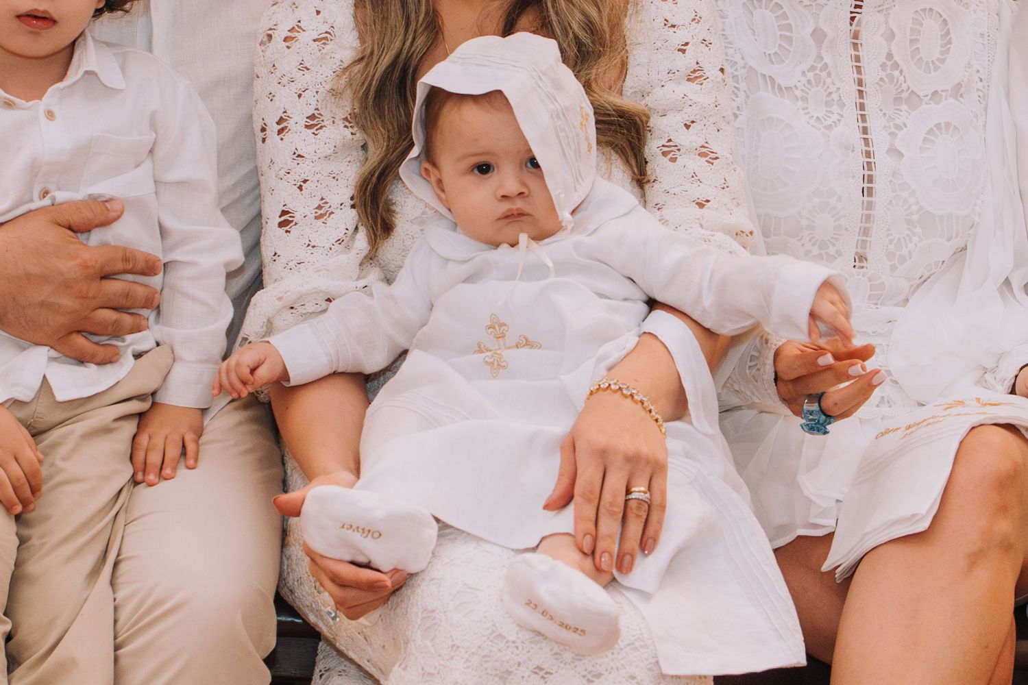 Candid moments captured of guests in white attire during a celebration.
