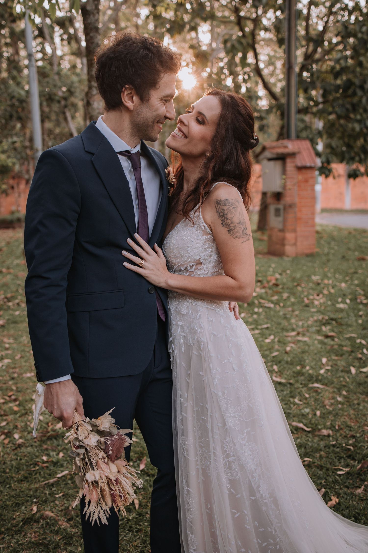 A romantic autumn wedding photo sequence shows a couple sharing tender moments among fallen leaves in a garden setting.