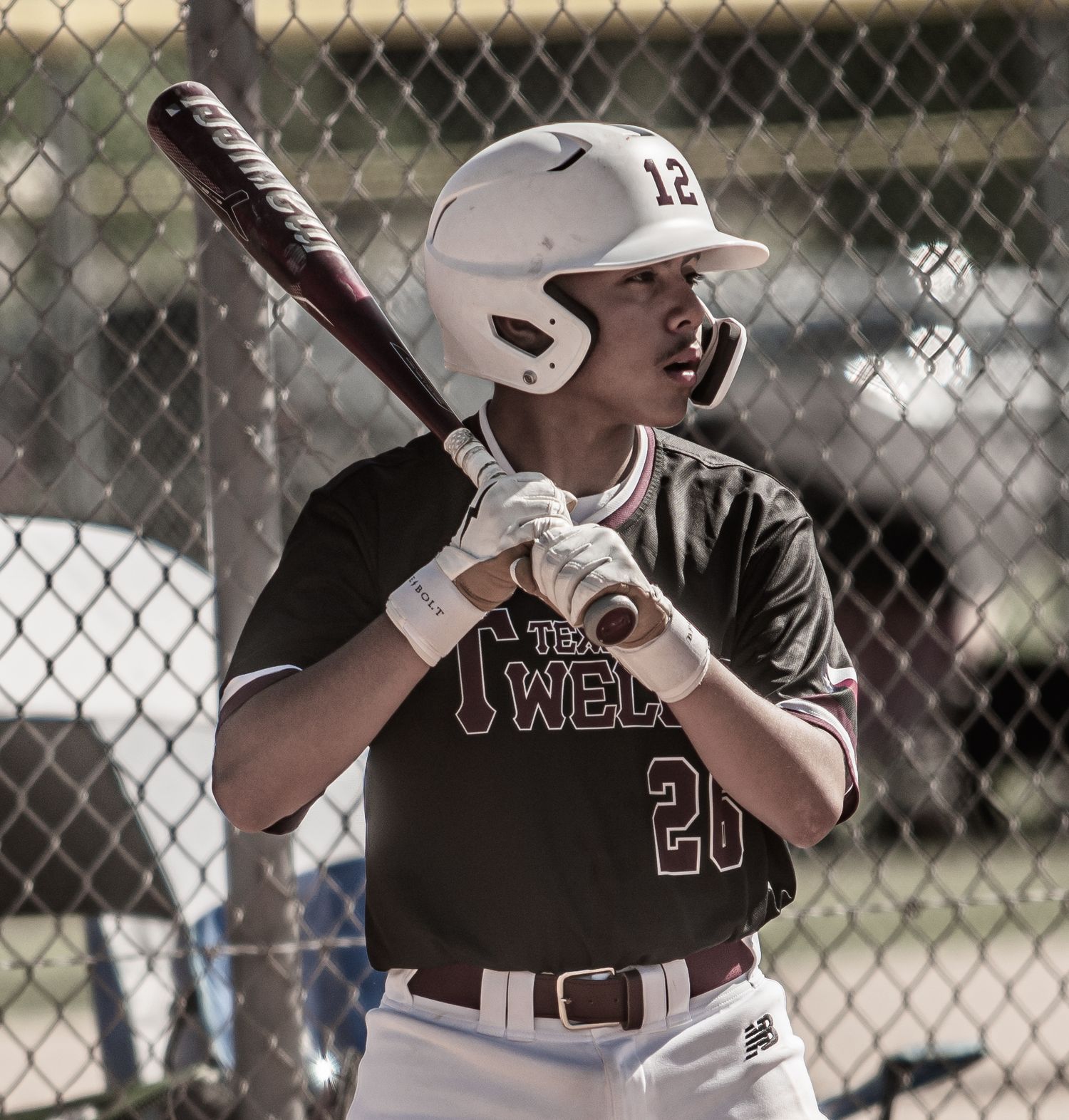 Baseball players in batting stance positions during a game.