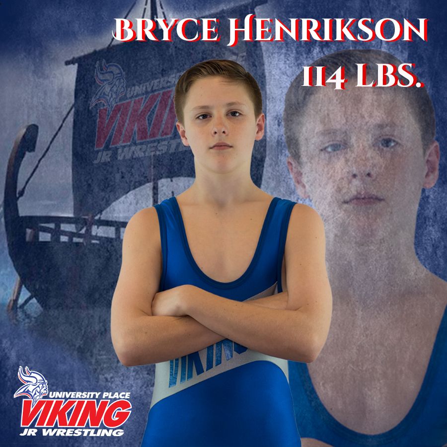 Young wrestler in a blue singlet stands with crossed arms against a dramatic background with team branding.
