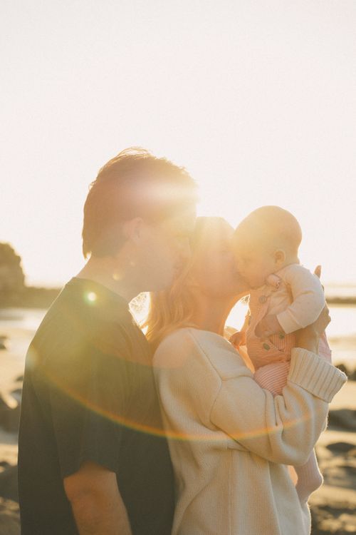 Close-up of mother and baby hands showcasing intimate details during a family photography session in Mount Maunganui