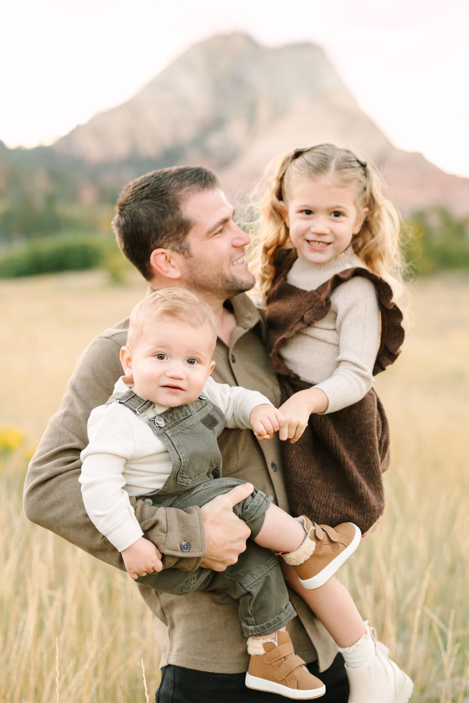 A heartwarming family moment captured in a series of photos showing playful interactions in a golden field at sunset.