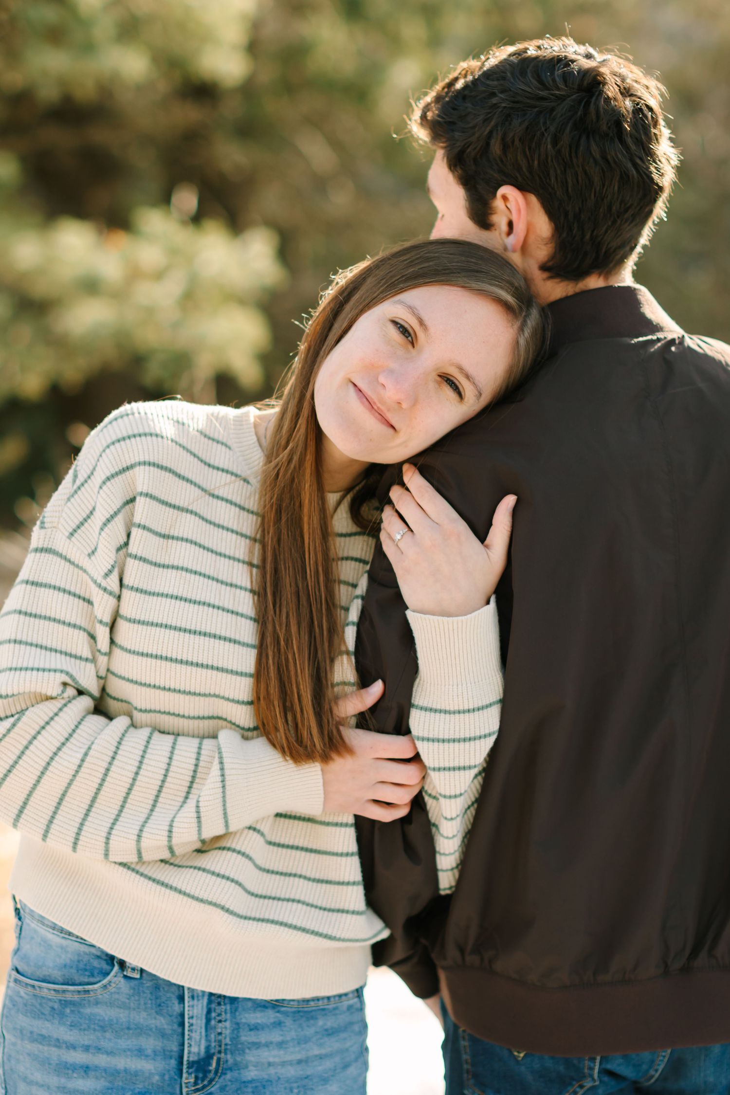 Romantic couple in casual sweaters sharing tender moments in a series of outdoor autumn photos.