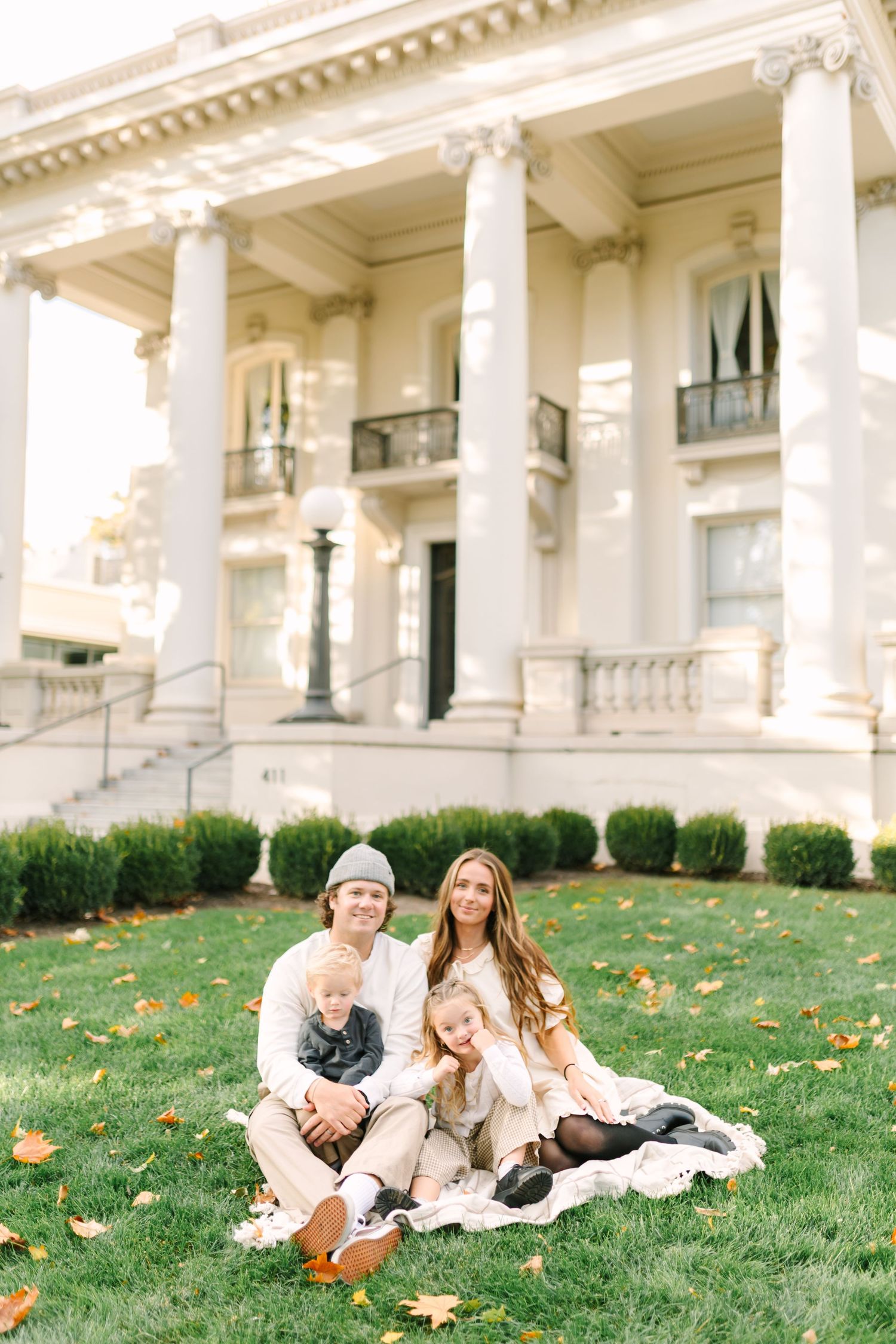 A young family plays together at the beautiful Monson Building in Salt Lake City, Utah.