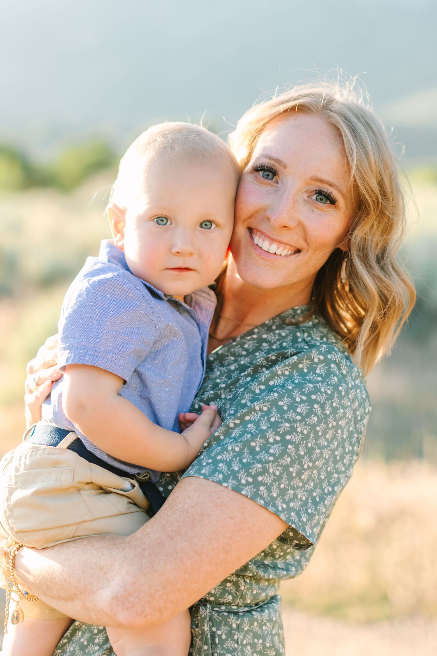 A parent and child share tender embraces in a series of outdoor portrait photos at sunset.