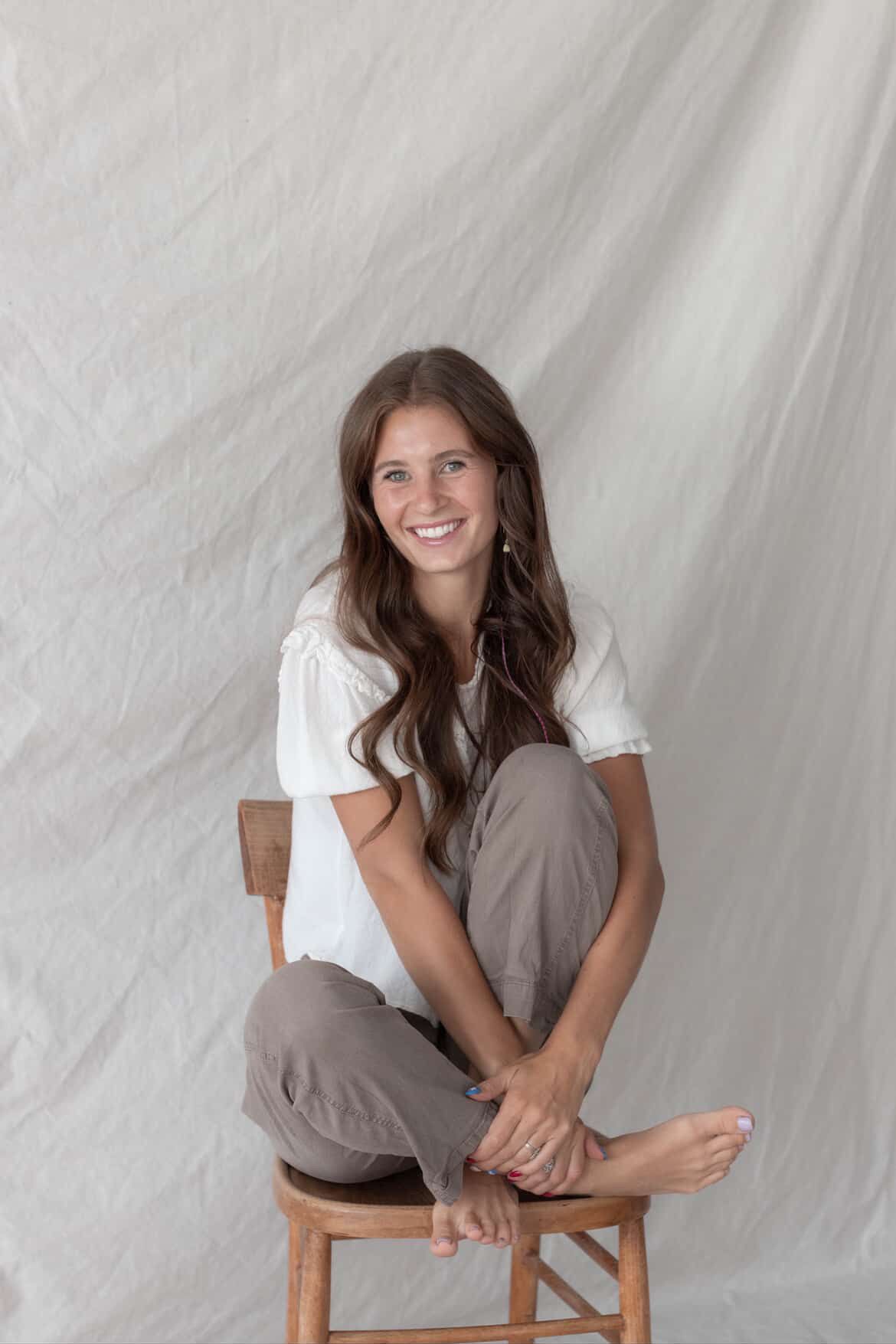 A series of casual portrait photos showing someone sitting in a wooden chair against a white backdrop.