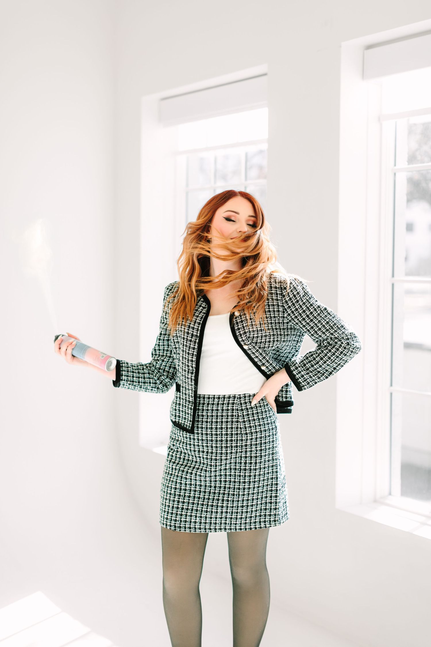 Fashion model poses in green plaid dress and tights against white backdrop in four dynamic poses.