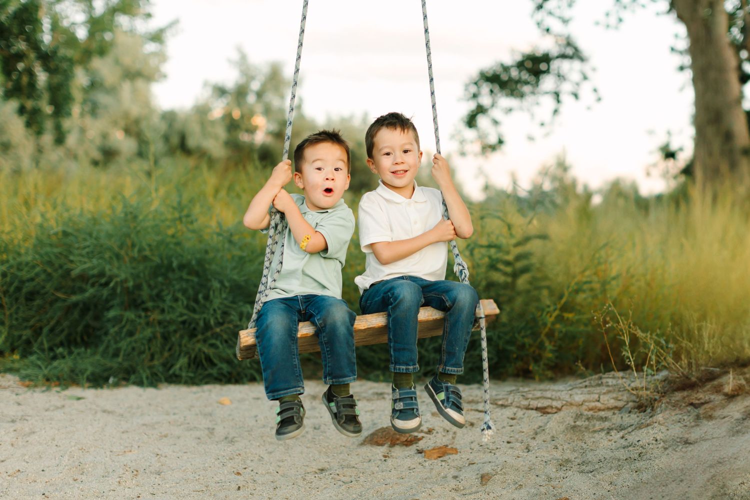 A series of candid outdoor family photos showing children playing and sitting together in a natural setting.