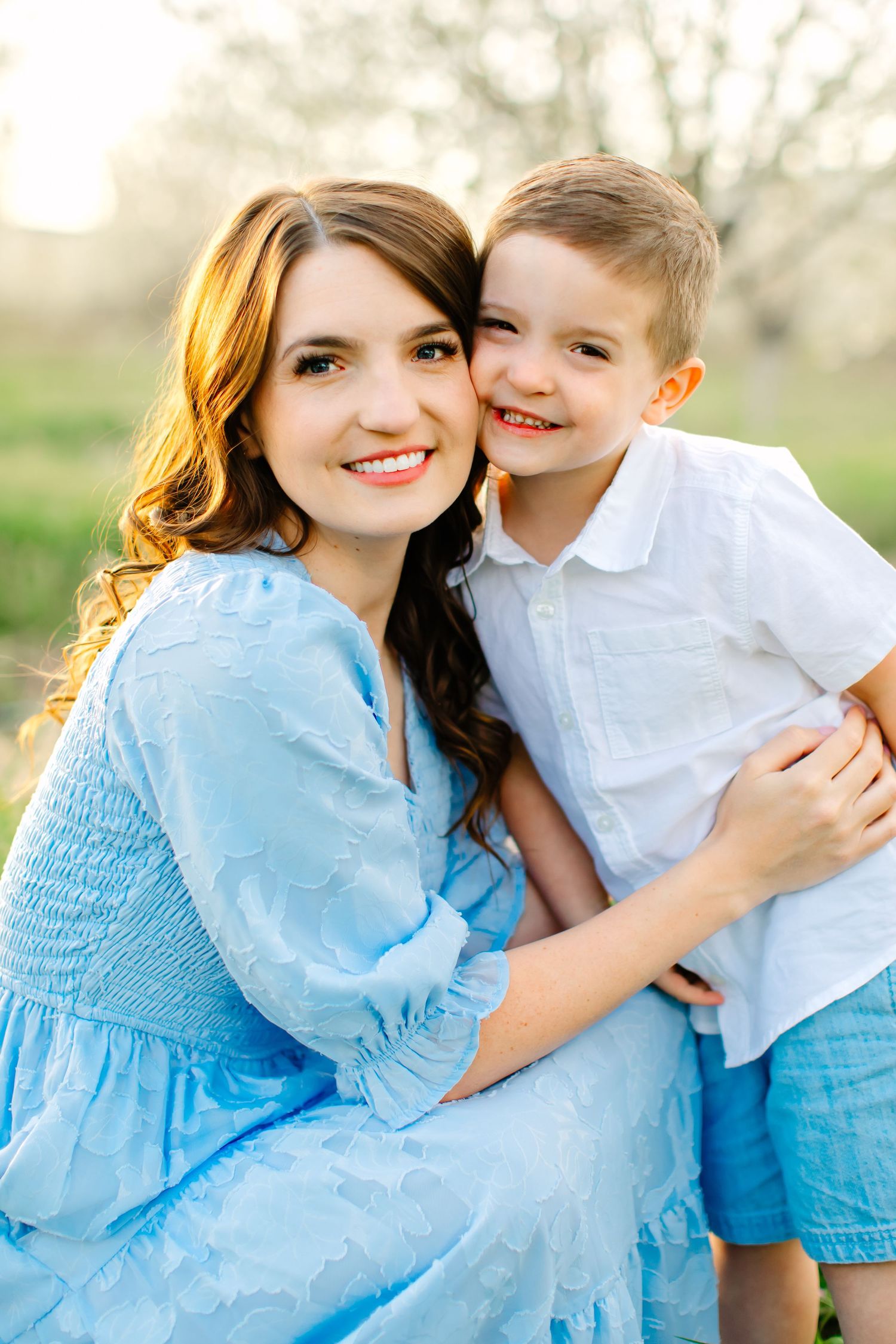 A series of tender moments captured in soft sunlight during their family photoshoot in Santaquin, Utah.