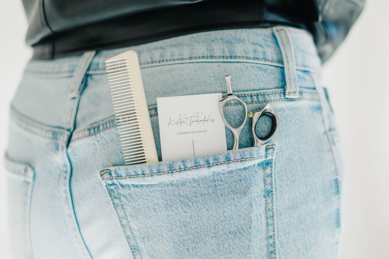 Close-up details of light blue denim jeans showing pocket and waistband design at White Space Studios in Provo, Utah in Utah County..