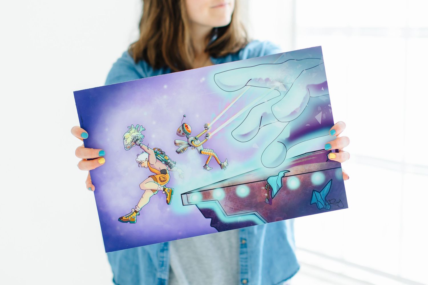 Artist holds vibrant purple artwork featuring animated characters at White Space Studios in Provo, Utah in Utah County..