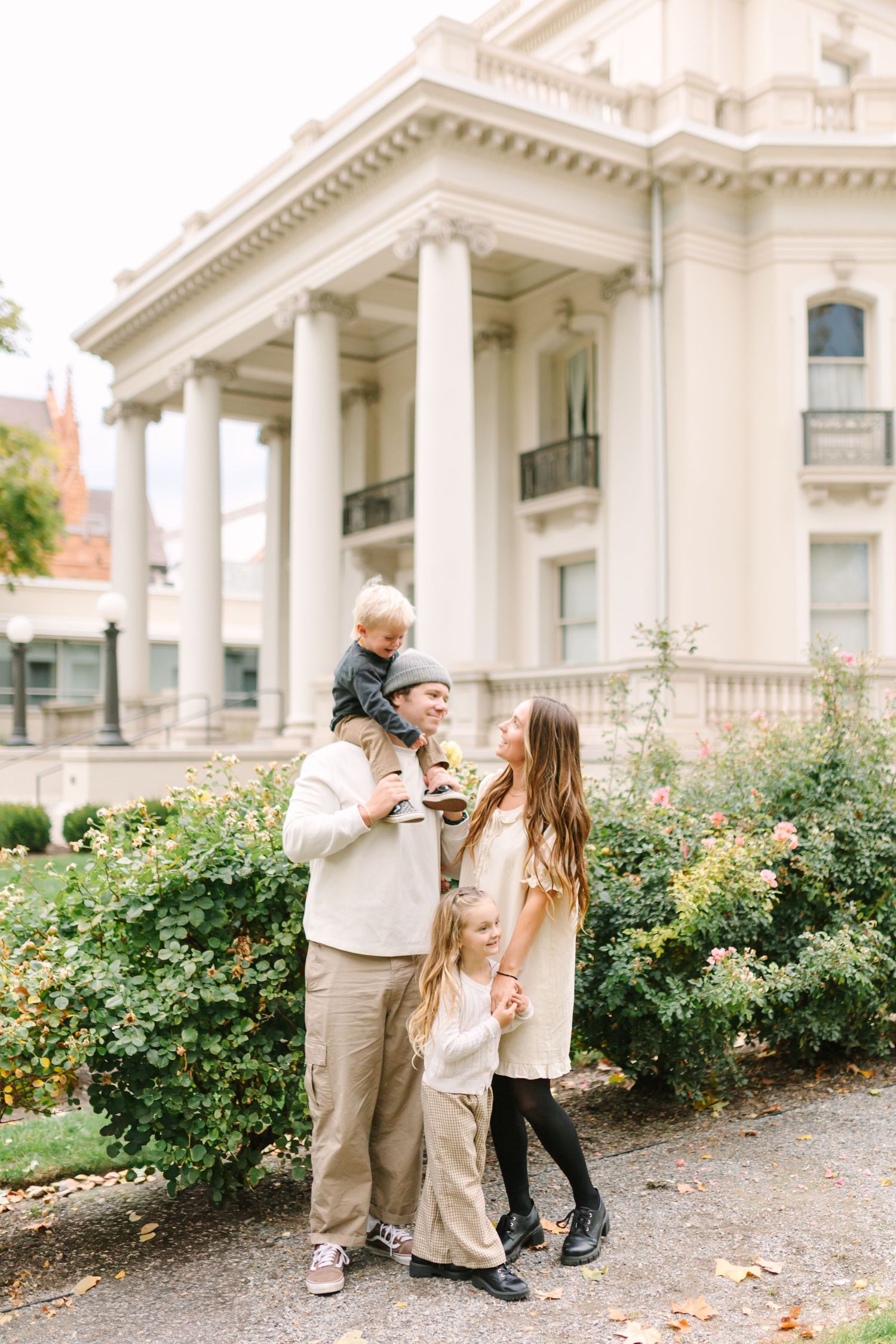 A young family plays together at the beautiful Monson Building in Salt Lake City, Utah.