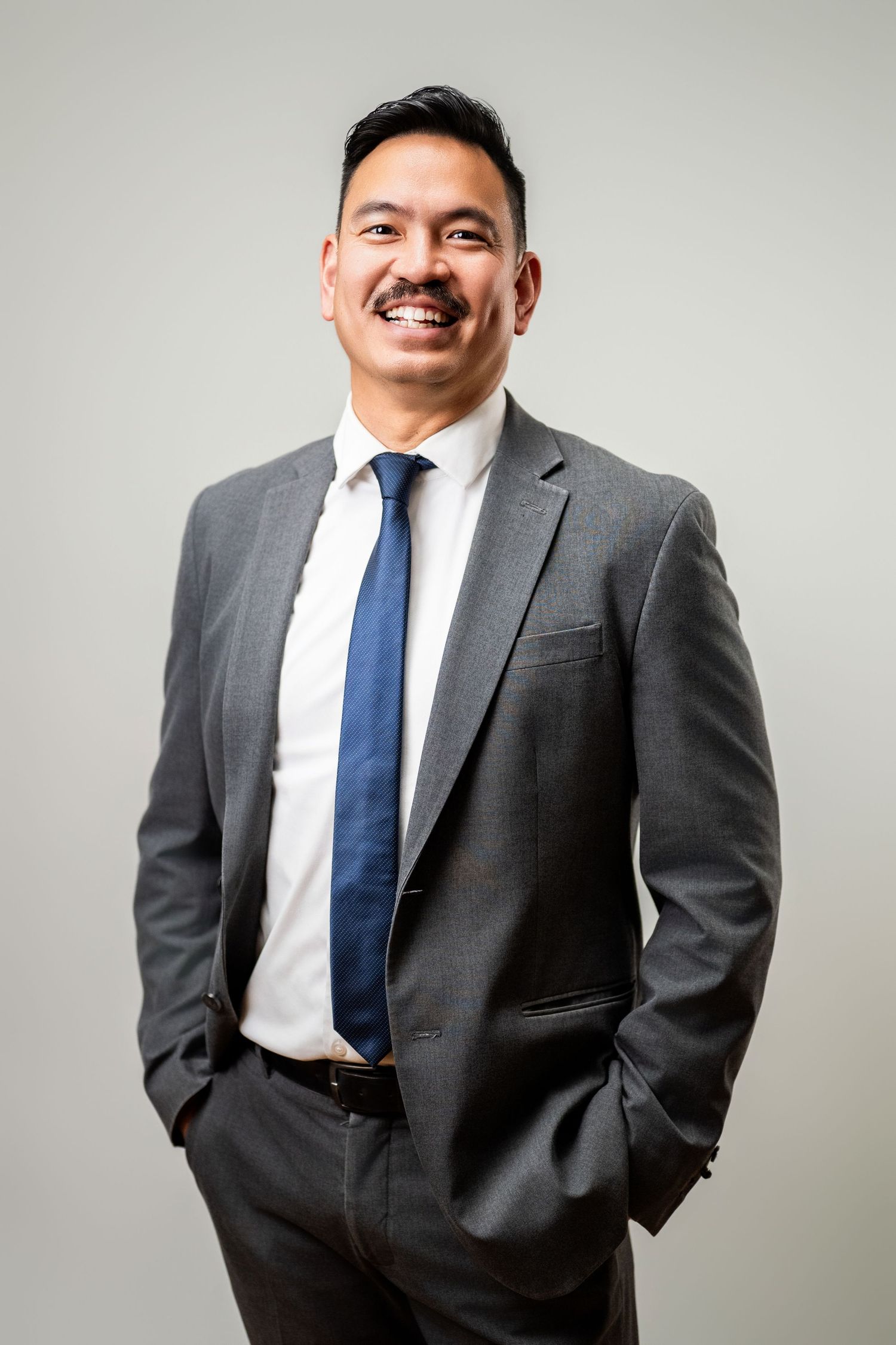 Business headshot wardrobe example with gray suit and tie for professional headshots in Los Angeles
