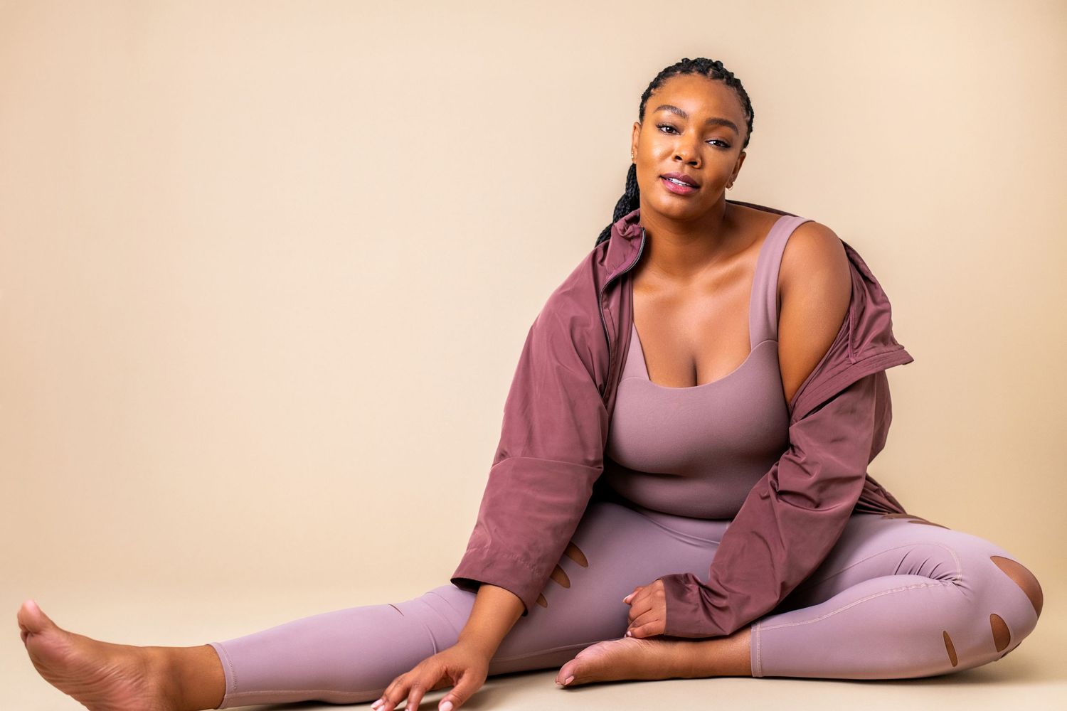 Los Angeles modeling headshot featuring a woman in mauve activewear with soft studio lighting and neutral background