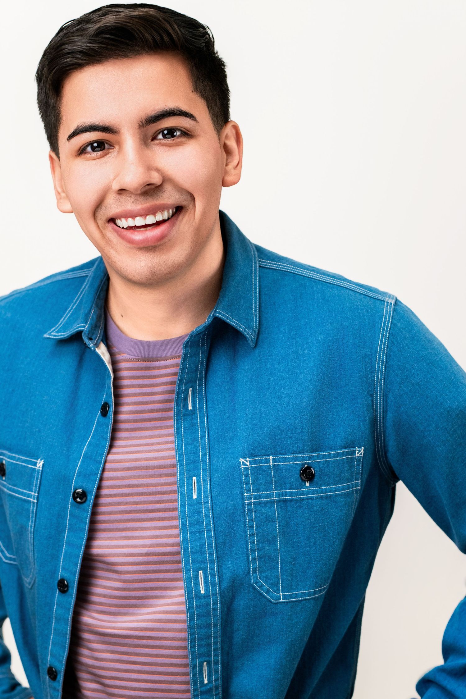 Actor headshot with a warm smile and clean studio lighting in Los Angeles