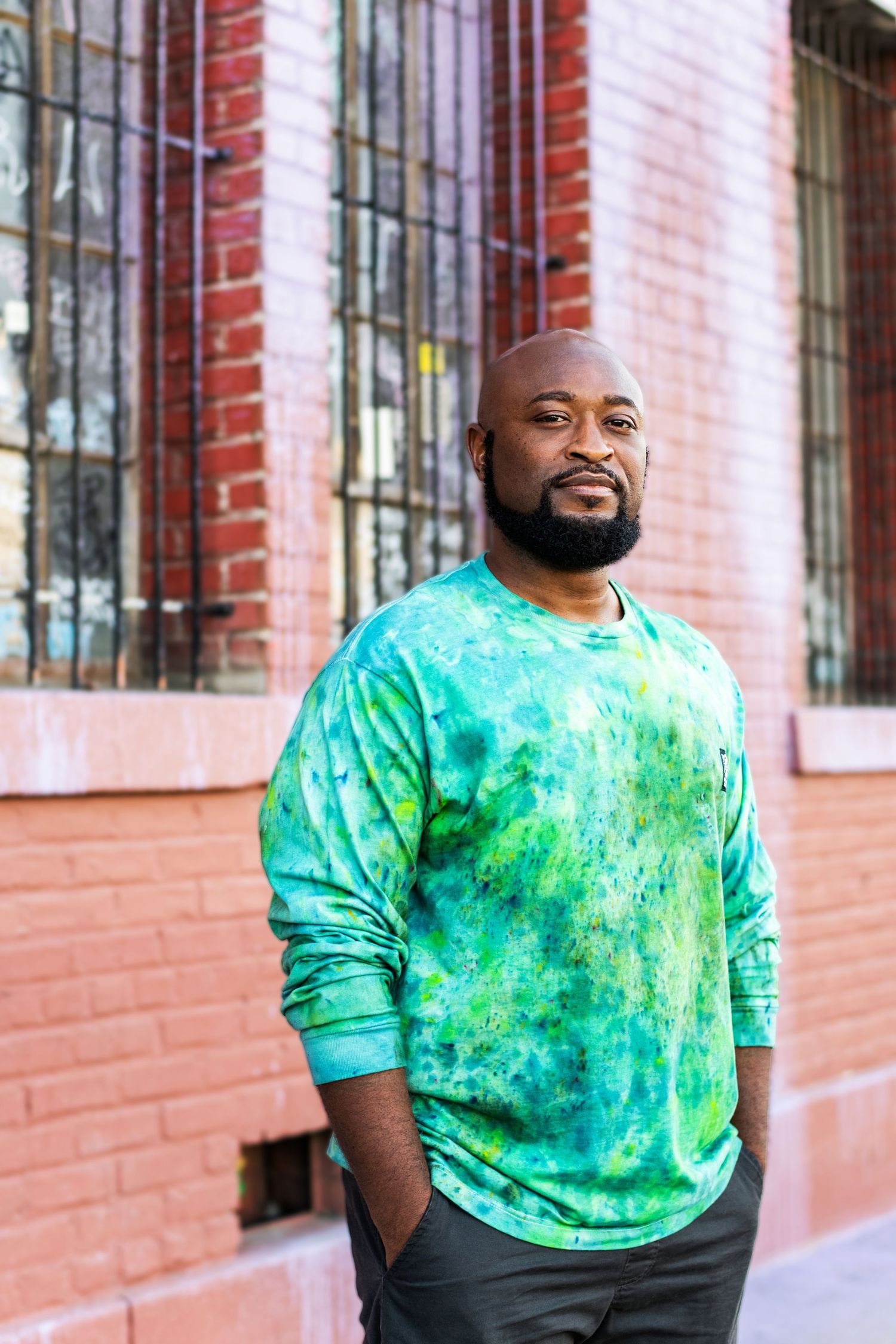 Professional personal branding headshot in Los Angeles of a man standing confidently outdoors with an approachable expression
