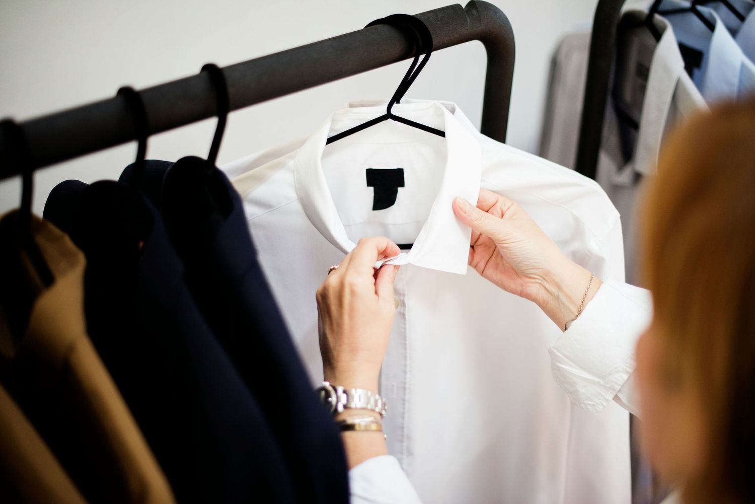 Selecting a crisp white button-down shirt for business headshot wardrobe options