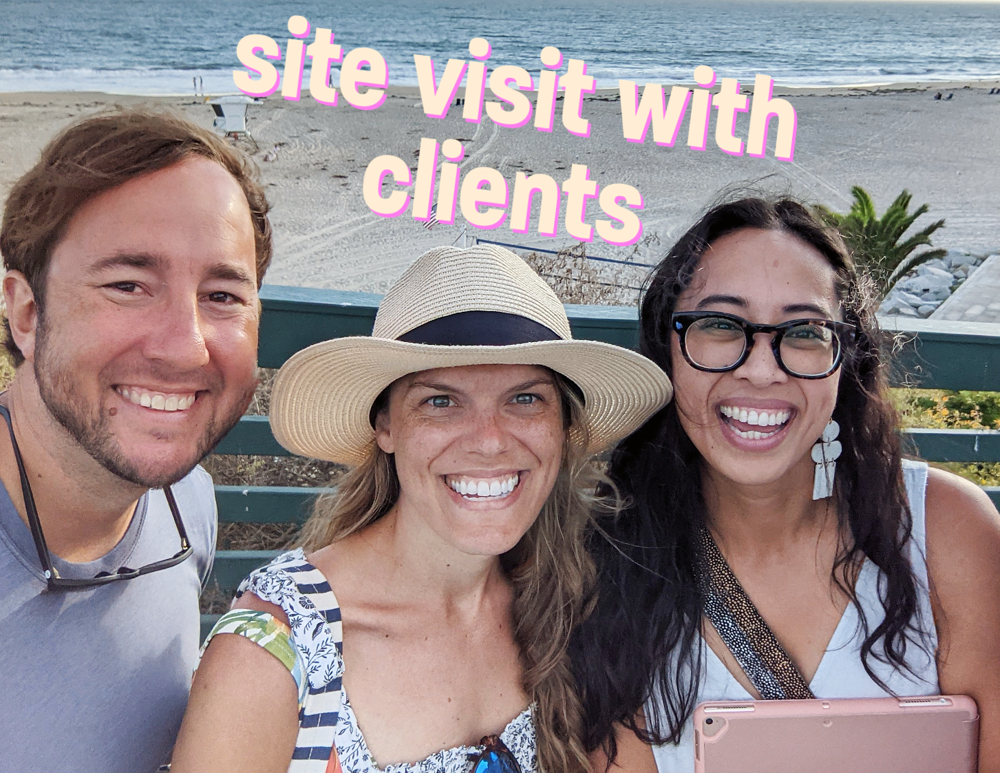 Wedding photographer on a site visit with clients at a beach venue, preparing to capture their special day with a personalized approach.