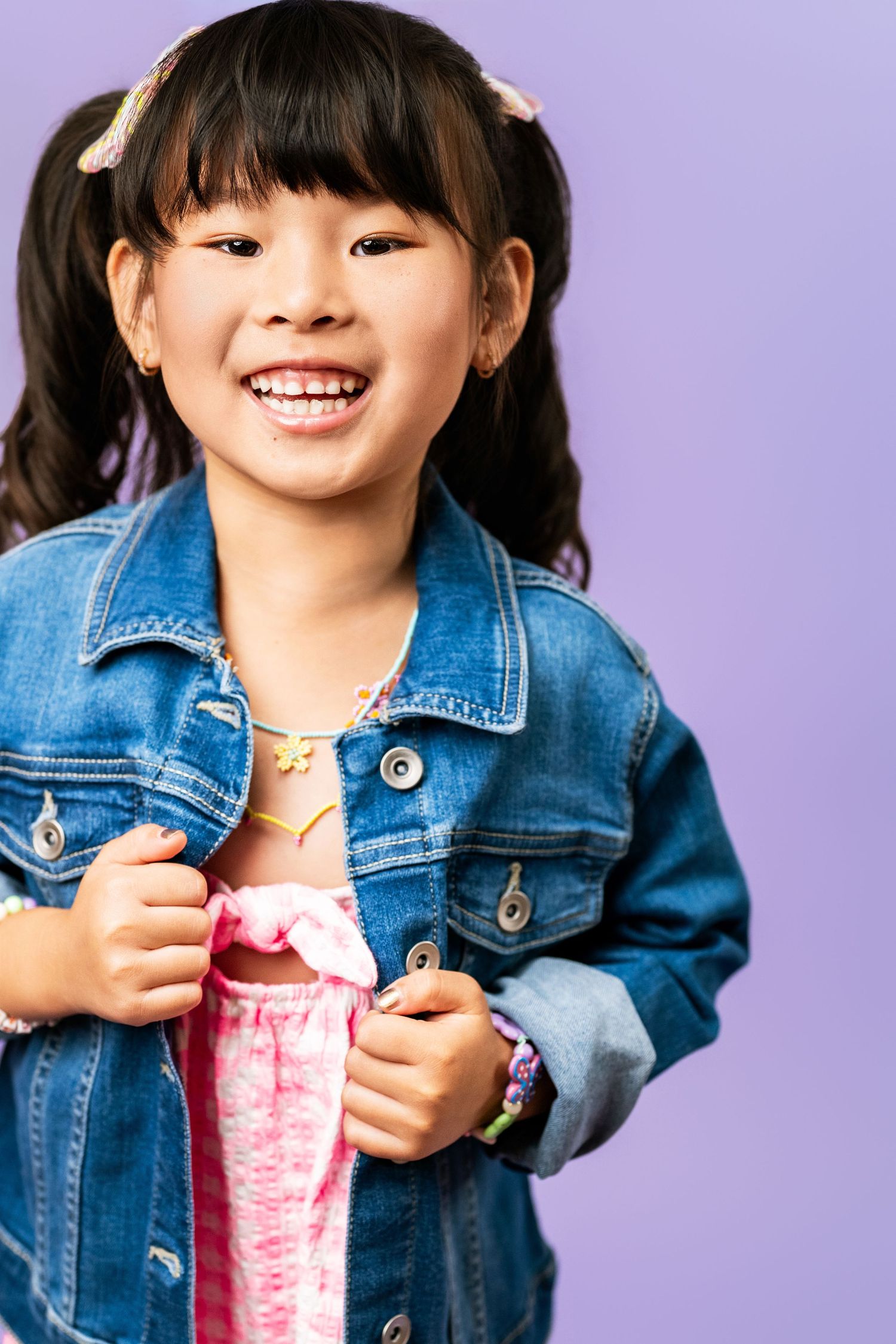 child actor headshot girl smiling denim jacket colorful background los angeles