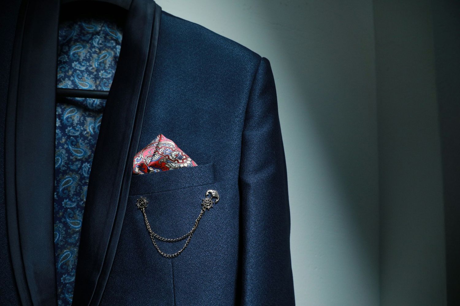 Business suit with patterned shirt, pocket square, and accessories showing personality in professional headshot styling