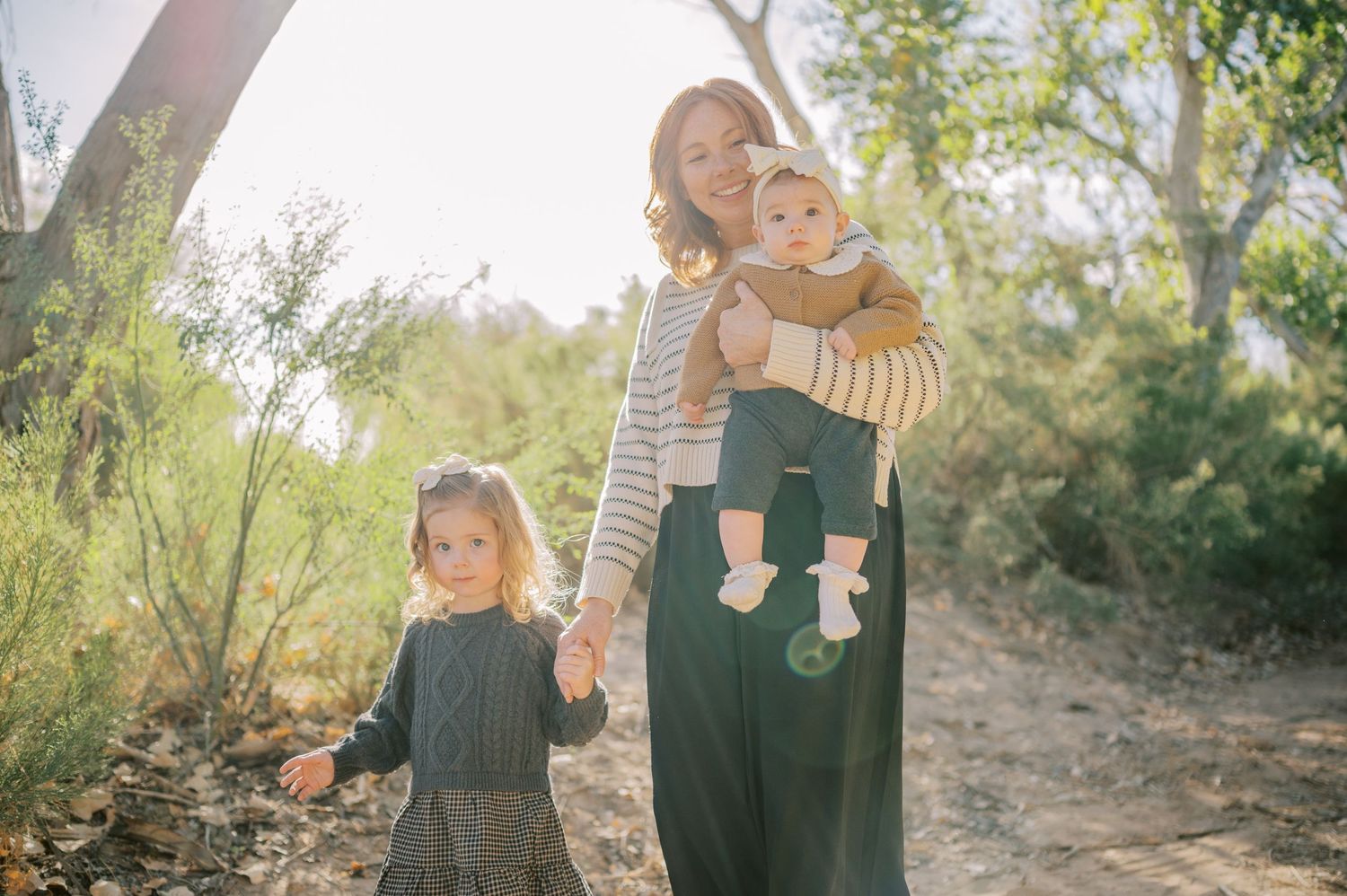 Luxury Gilbert Arizona family photography surrounded by lush greenery. A relaxed, stress-free experience that captures real connection.