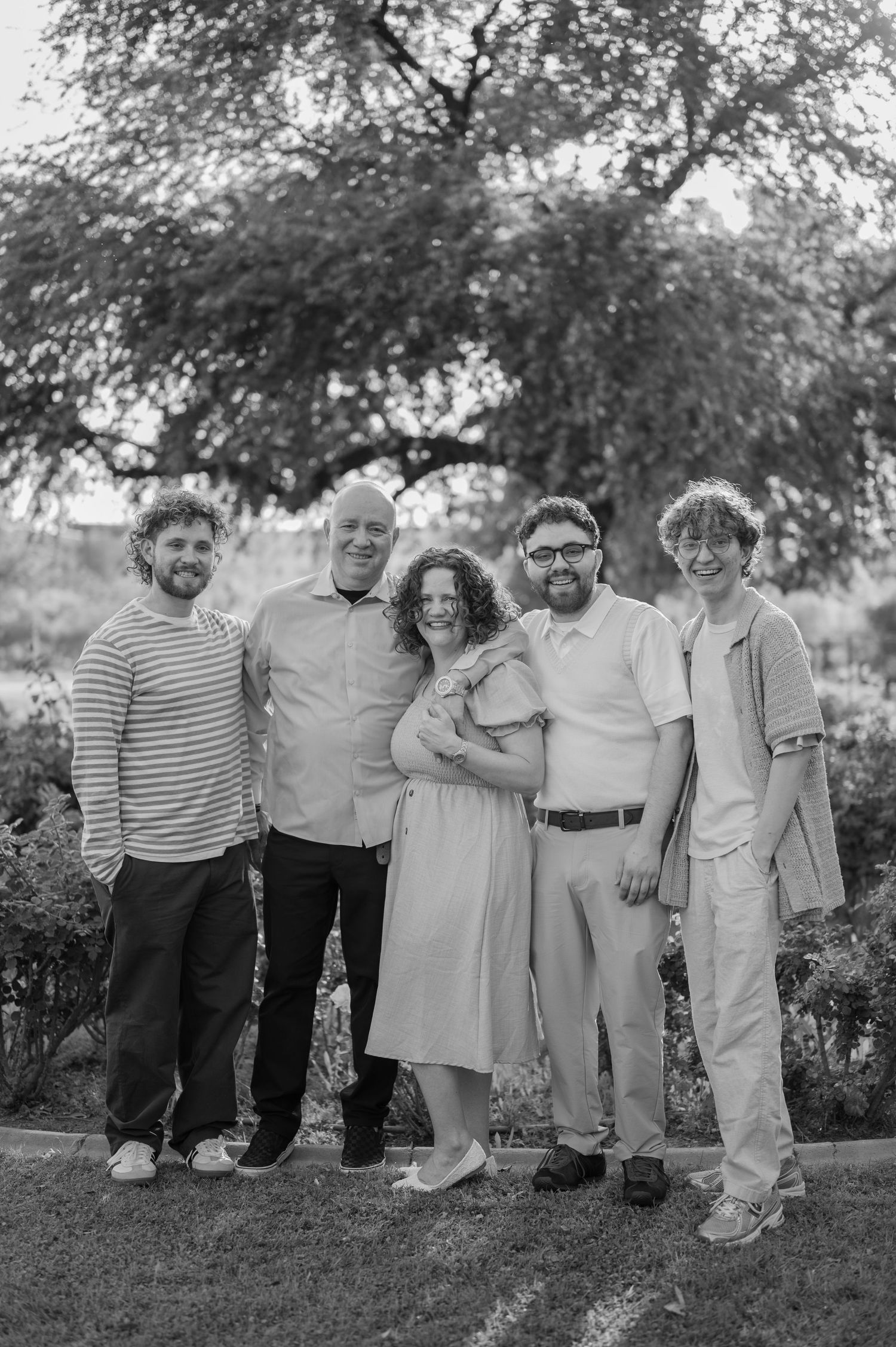 Extended family portrait in a blooming rose garden in Gilbert Arizona