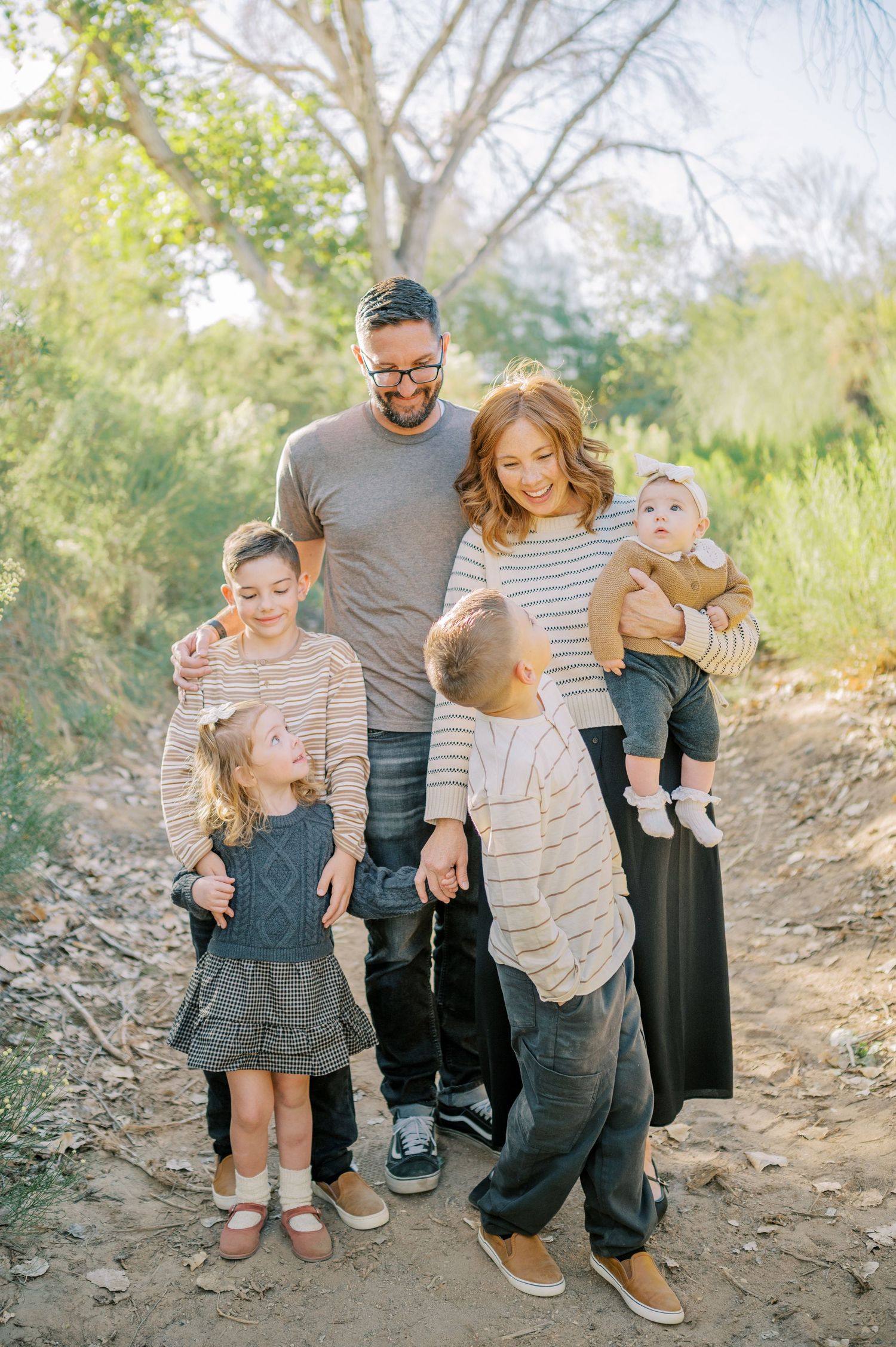 Luxury Gilbert Arizona family photography surrounded by lush greenery. A relaxed, stress-free experience that captures real connection.