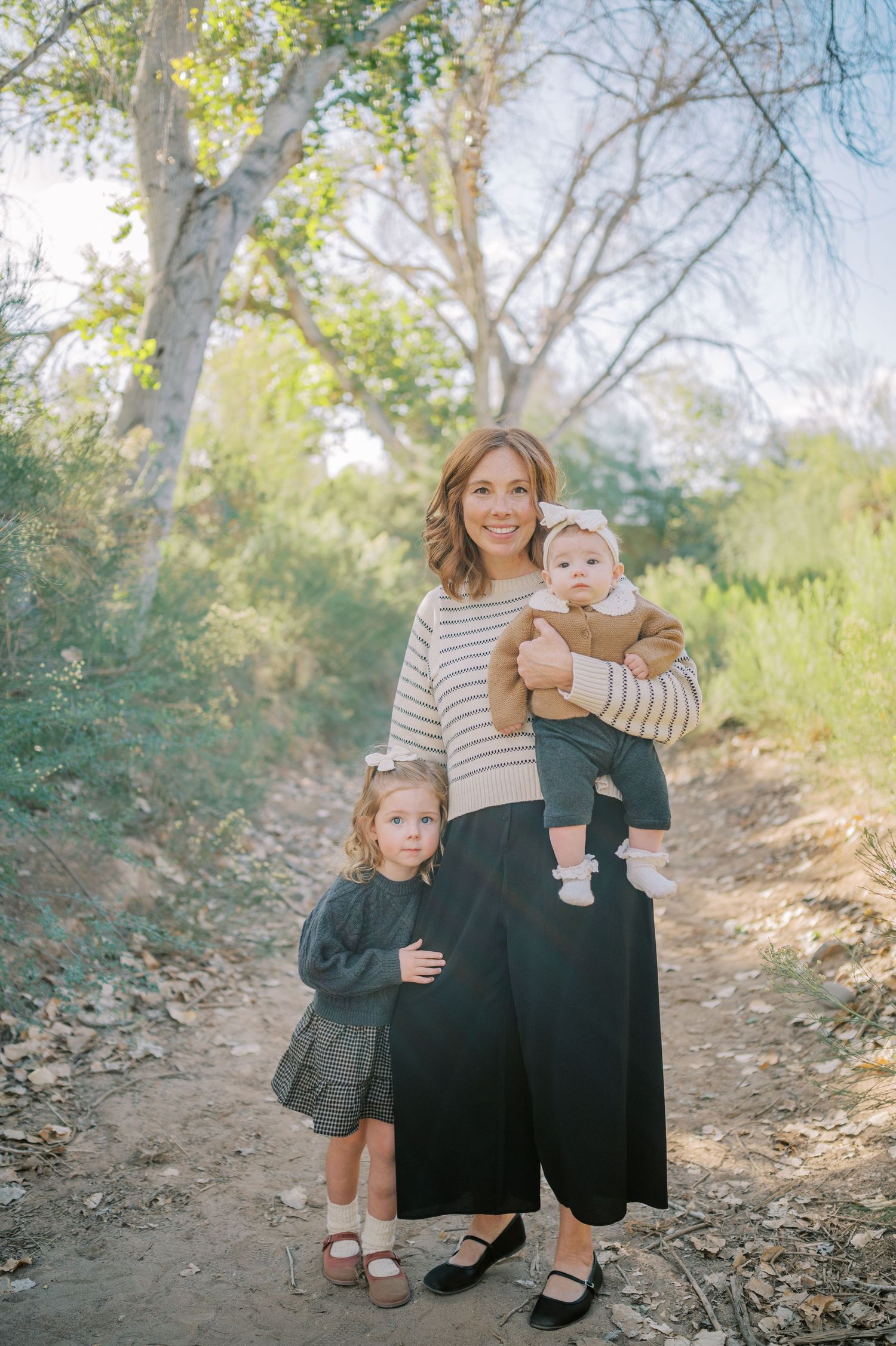Luxury Gilbert Arizona family photography surrounded by lush greenery. A relaxed, stress-free experience that captures real connection.