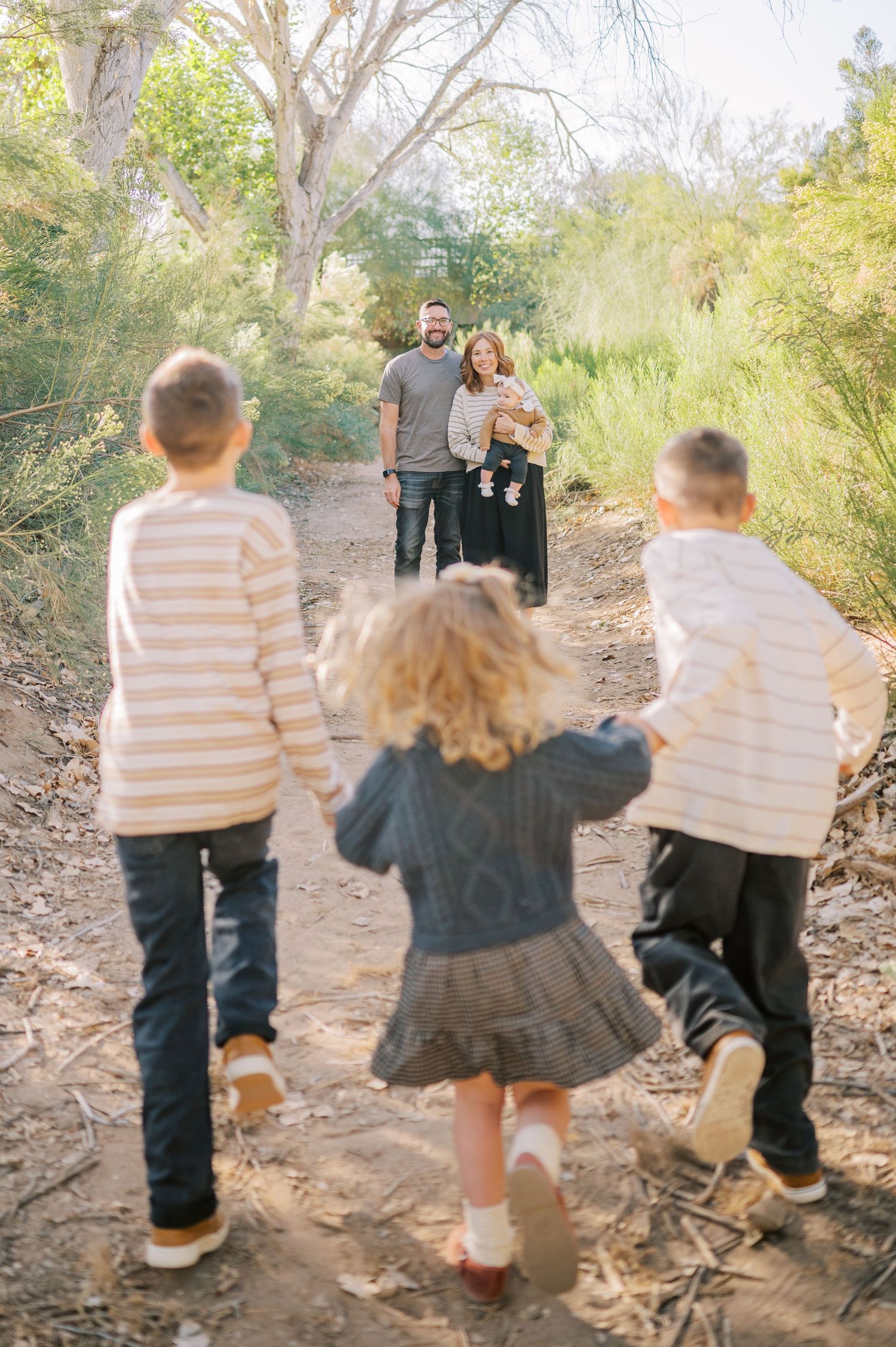 Luxury Gilbert Arizona family photography surrounded by lush greenery. A relaxed, stress-free experience that captures real connection.