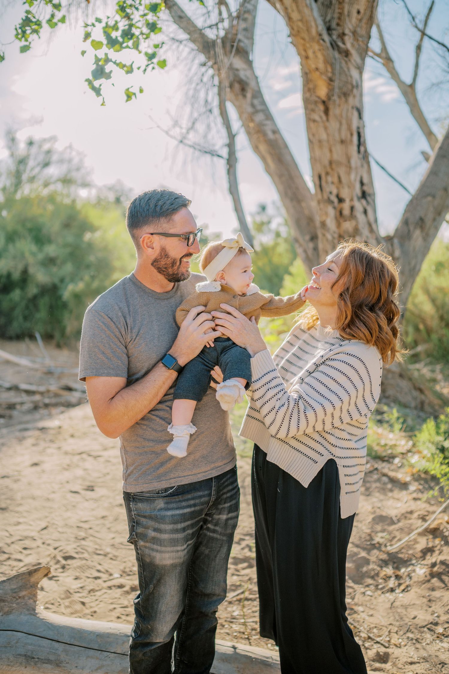 Luxury Gilbert Arizona family photography surrounded by lush greenery. A relaxed, stress-free experience that captures real connection.