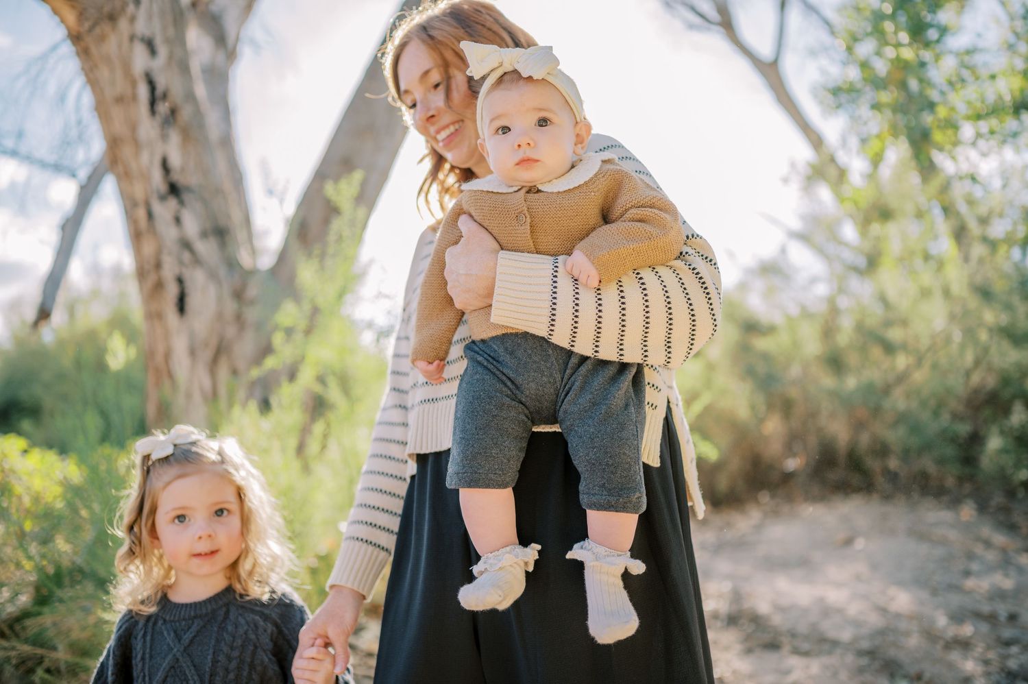 Luxury Gilbert Arizona family photography surrounded by lush greenery. A relaxed, stress-free experience that captures real connection.