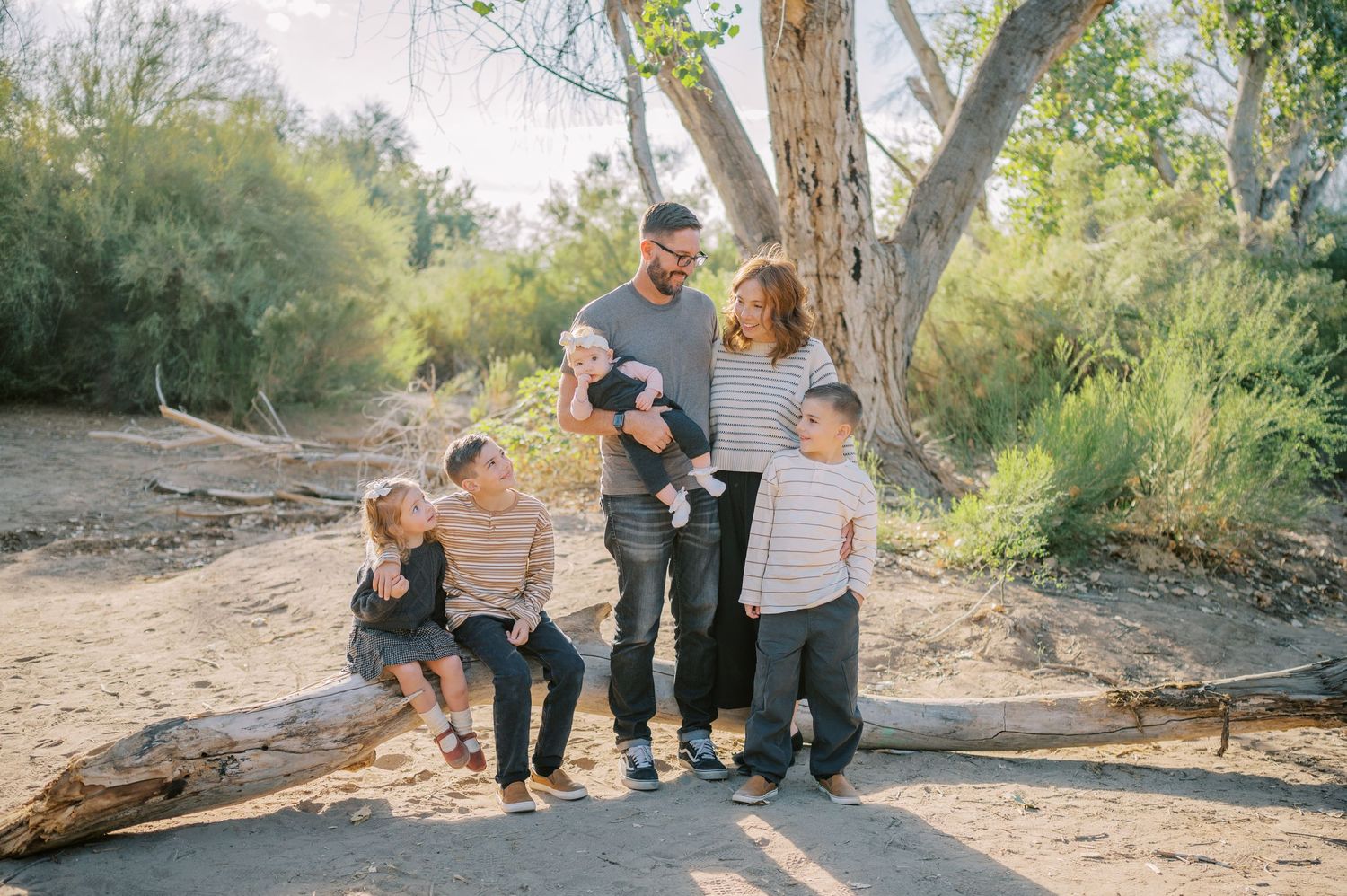 Luxury Gilbert Arizona family photography surrounded by lush greenery. A relaxed, stress-free experience that captures real connection.