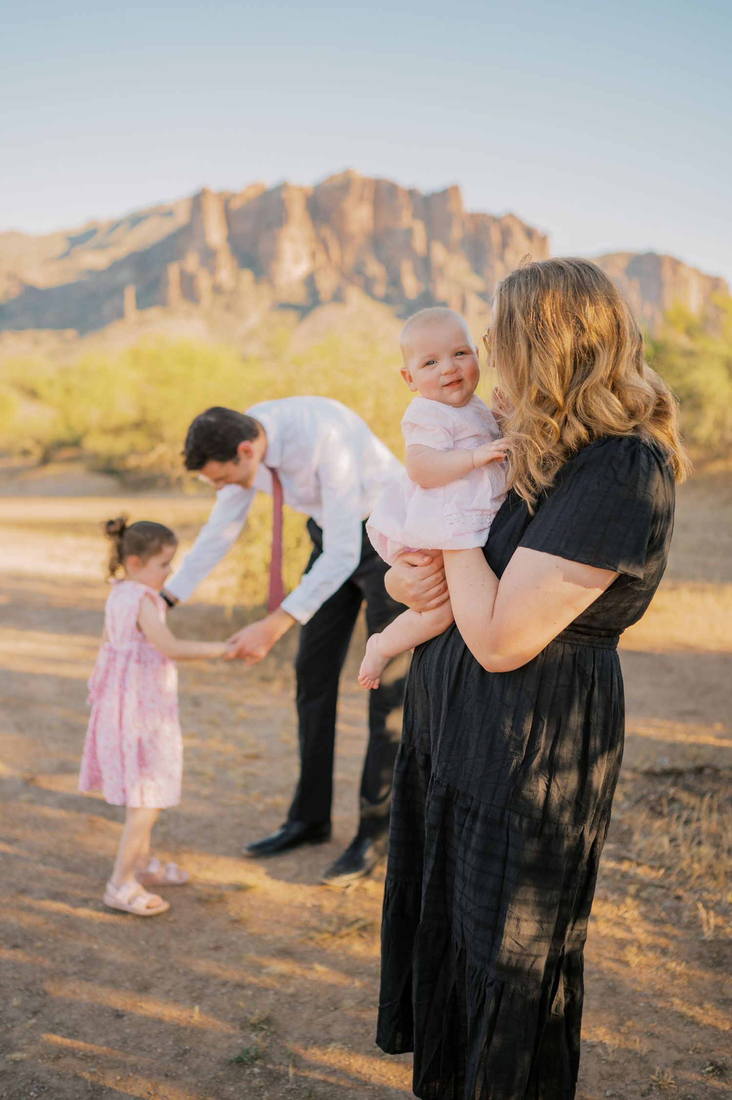 Family portrait in Arizona desert with rocky mountains