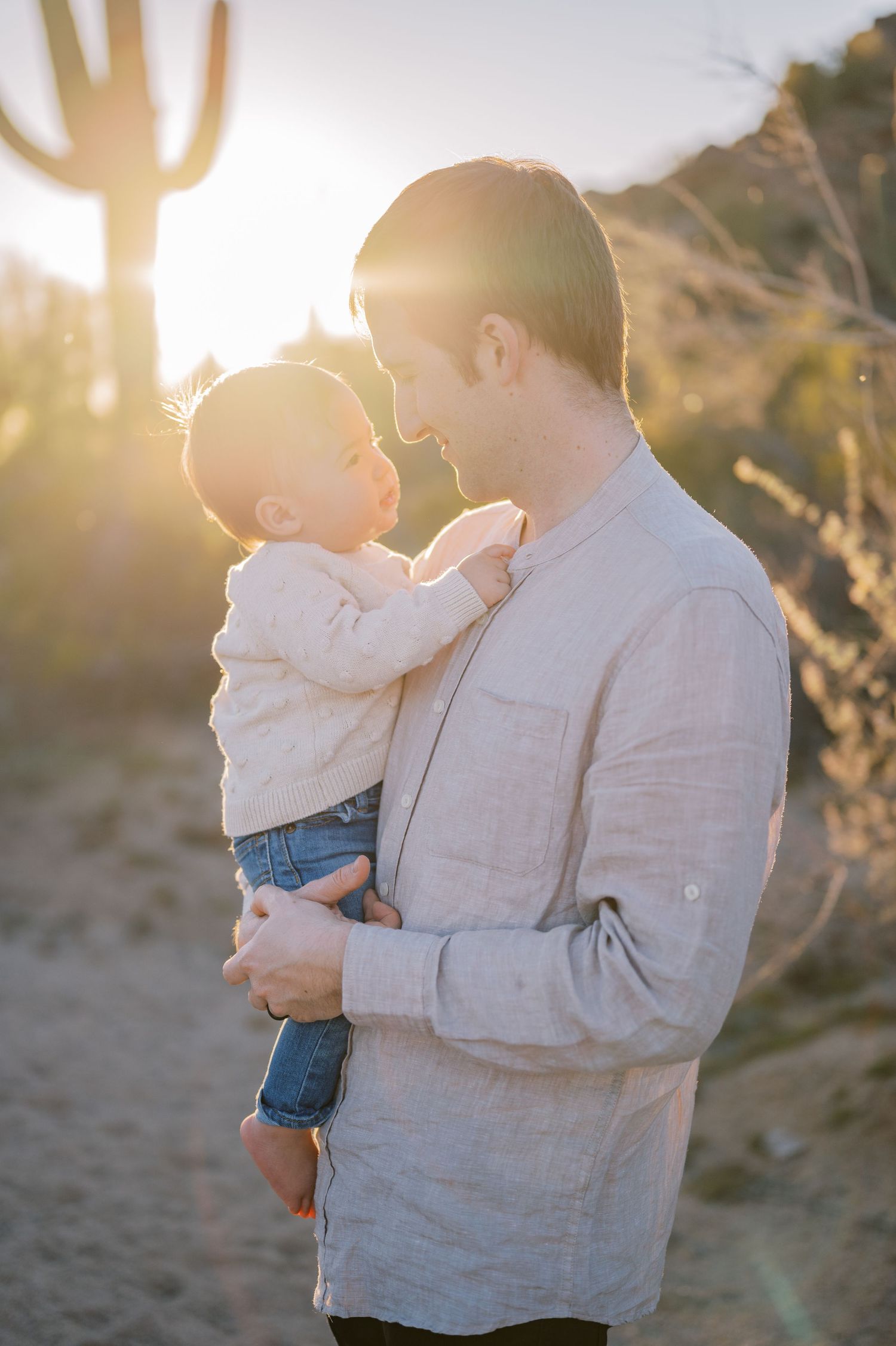 Phoenix Arizona sunset family photographer. Dad and son in the warm glow of the Arizona sunset. Phoenix Arizona family photographer.