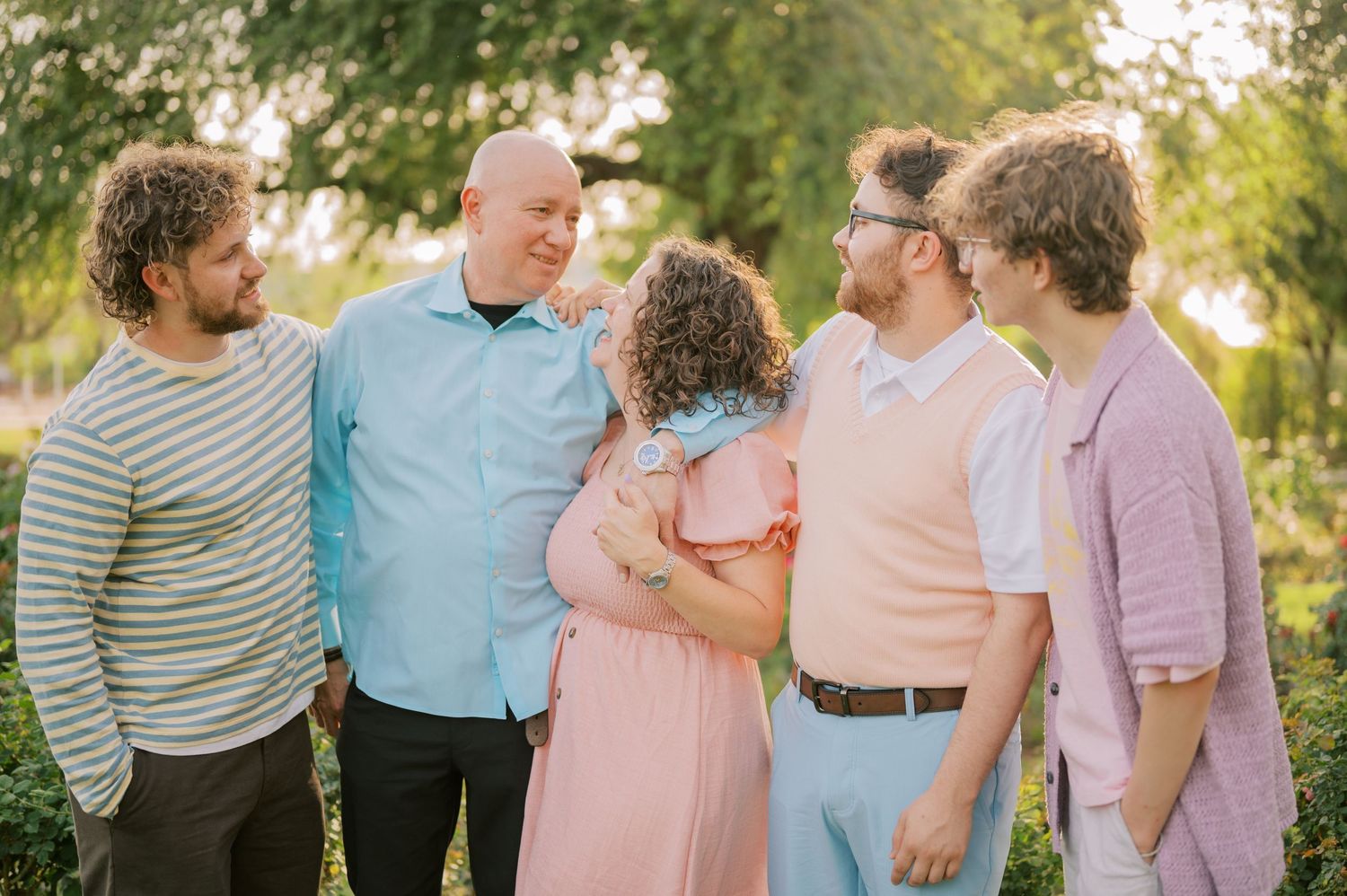 Phoenix Arizona family photographer capturing moments in rose garden setting