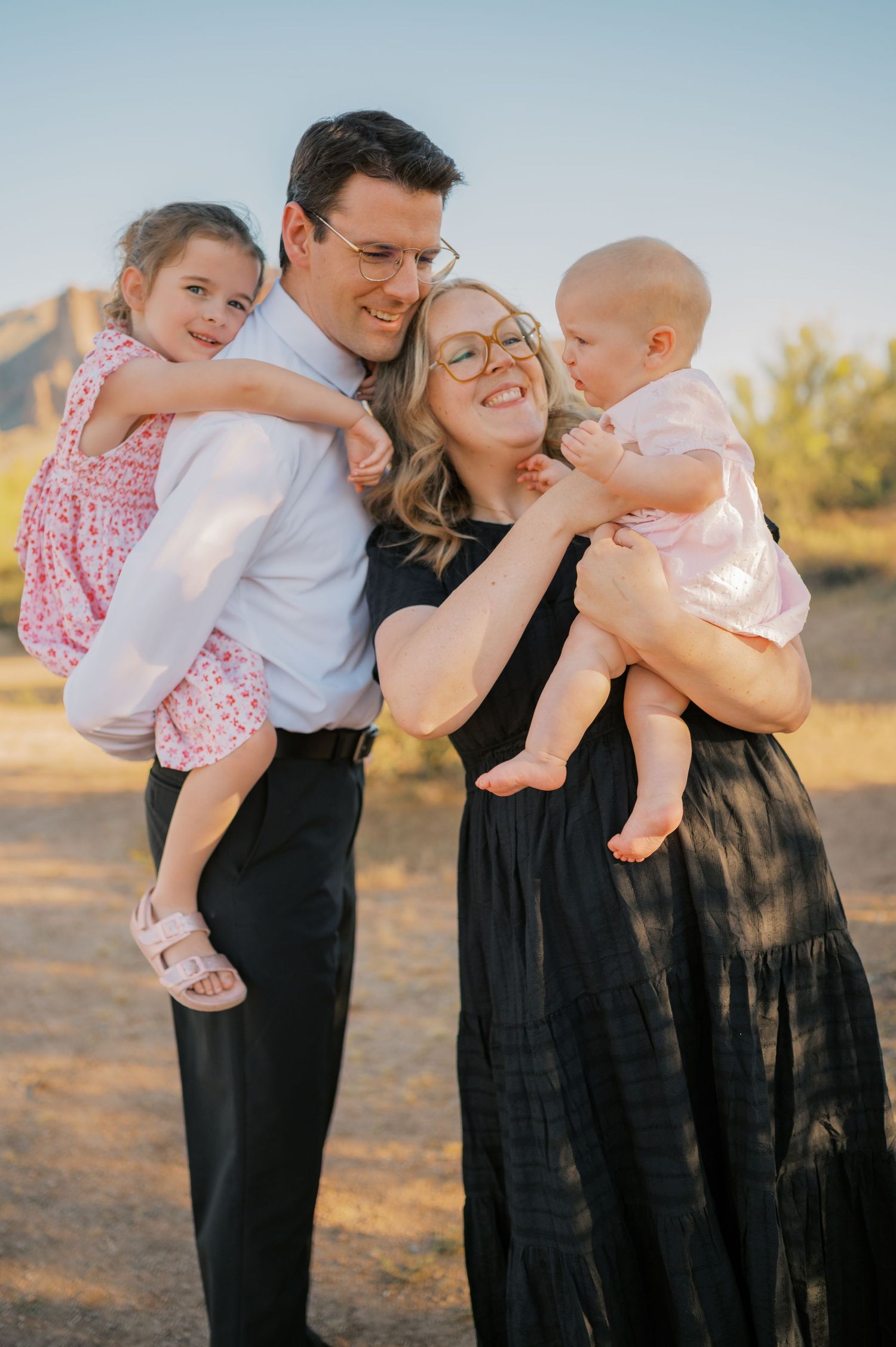 Sunset family portrait in the Superstition Mountains with warm desert tones