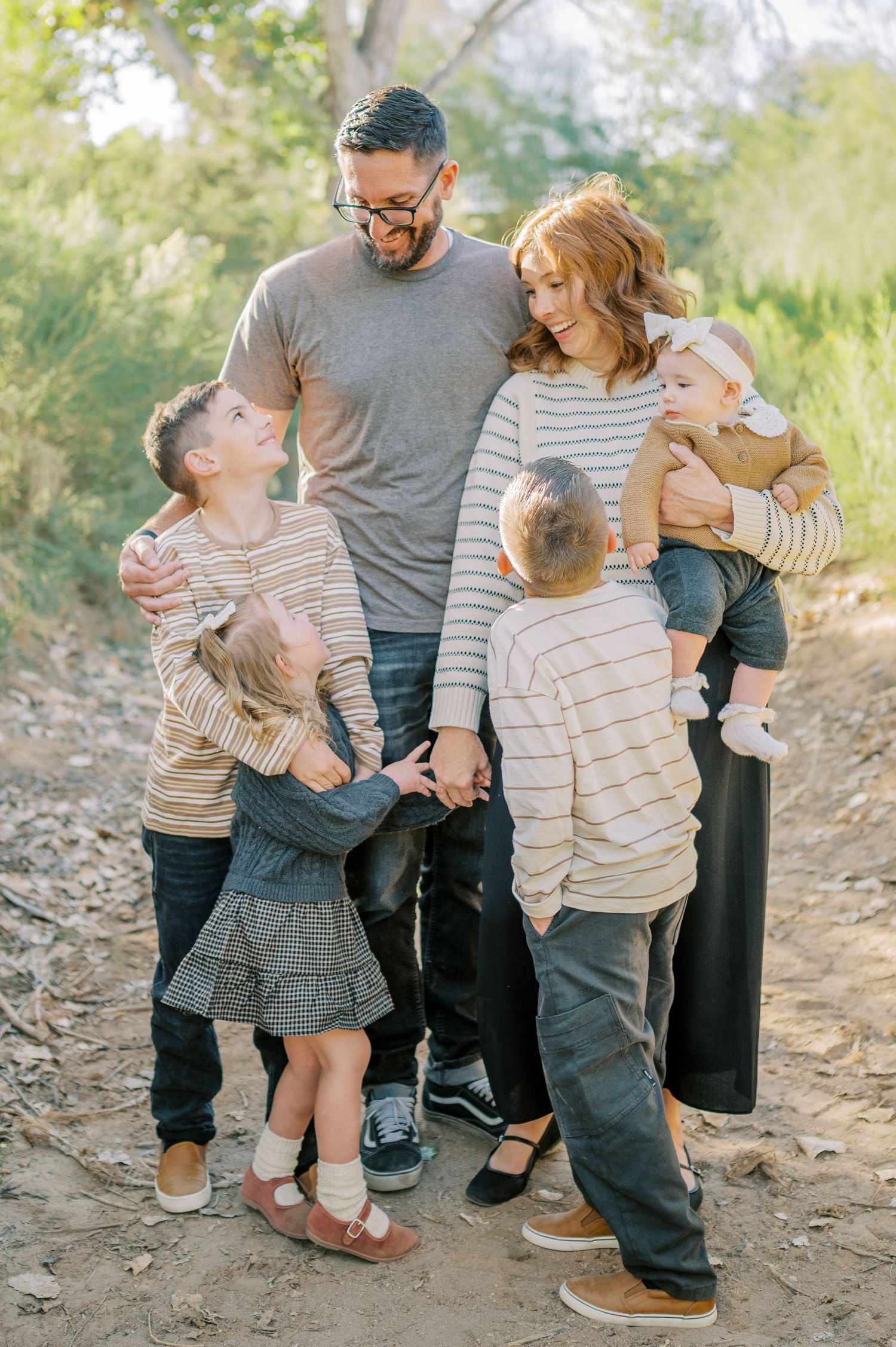 Luxury Gilbert Arizona family photography surrounded by lush greenery. A relaxed, stress-free experience that captures real connection.