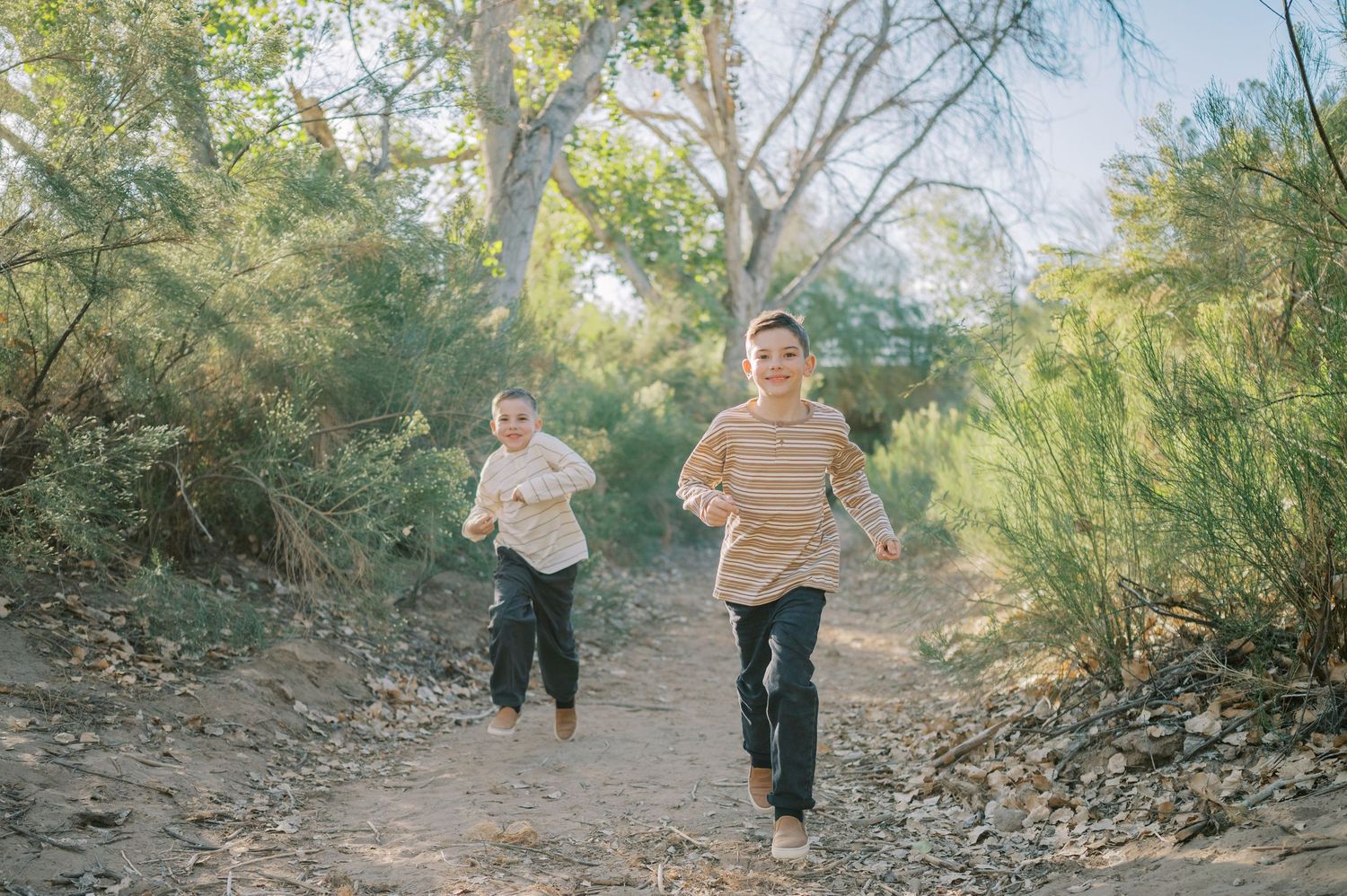 Luxury Gilbert Arizona family photography surrounded by lush greenery. A relaxed, stress-free experience that captures real connection.