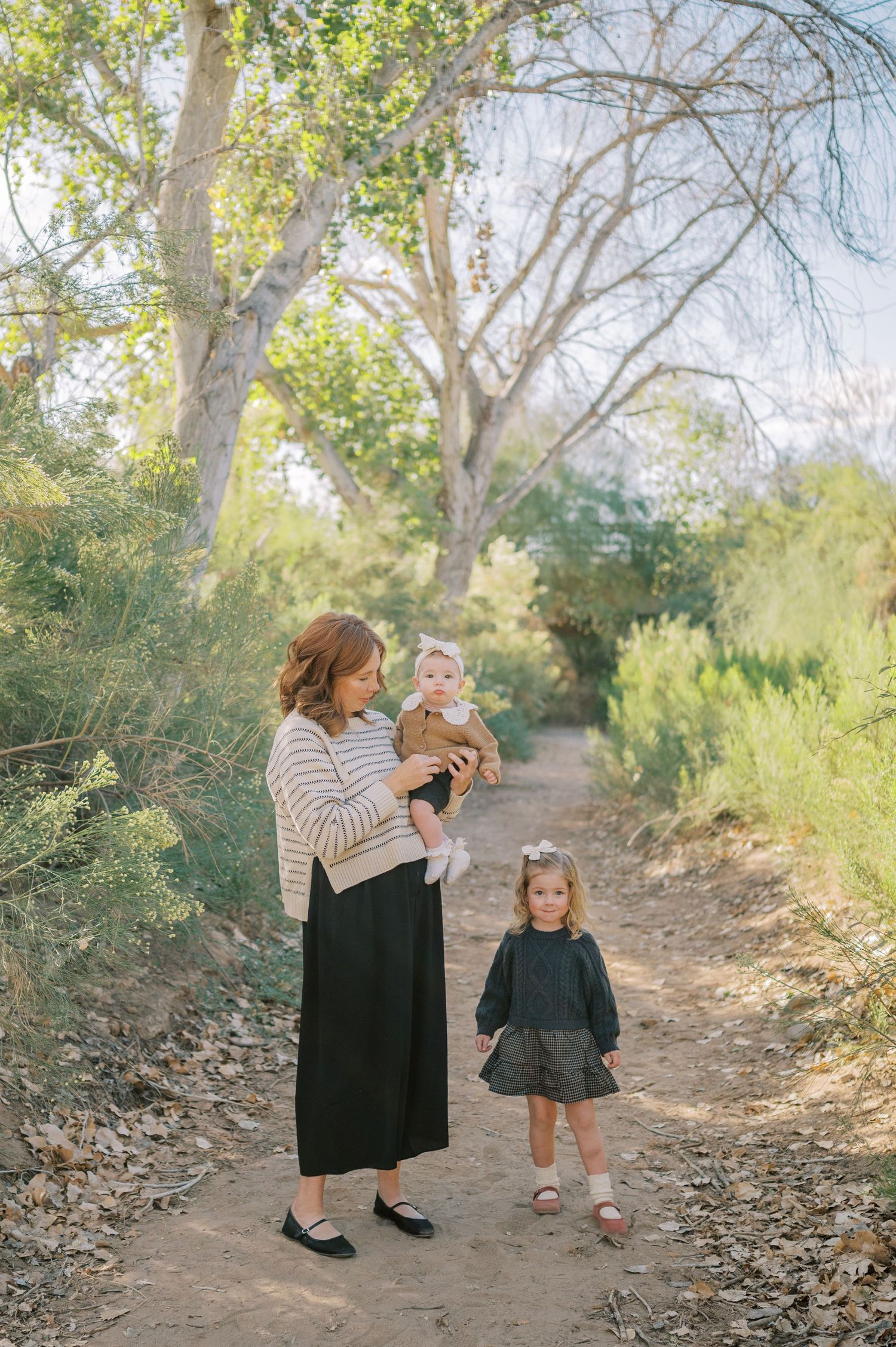 Luxury Gilbert Arizona family photography surrounded by lush greenery. A relaxed, stress-free experience that captures real connection.