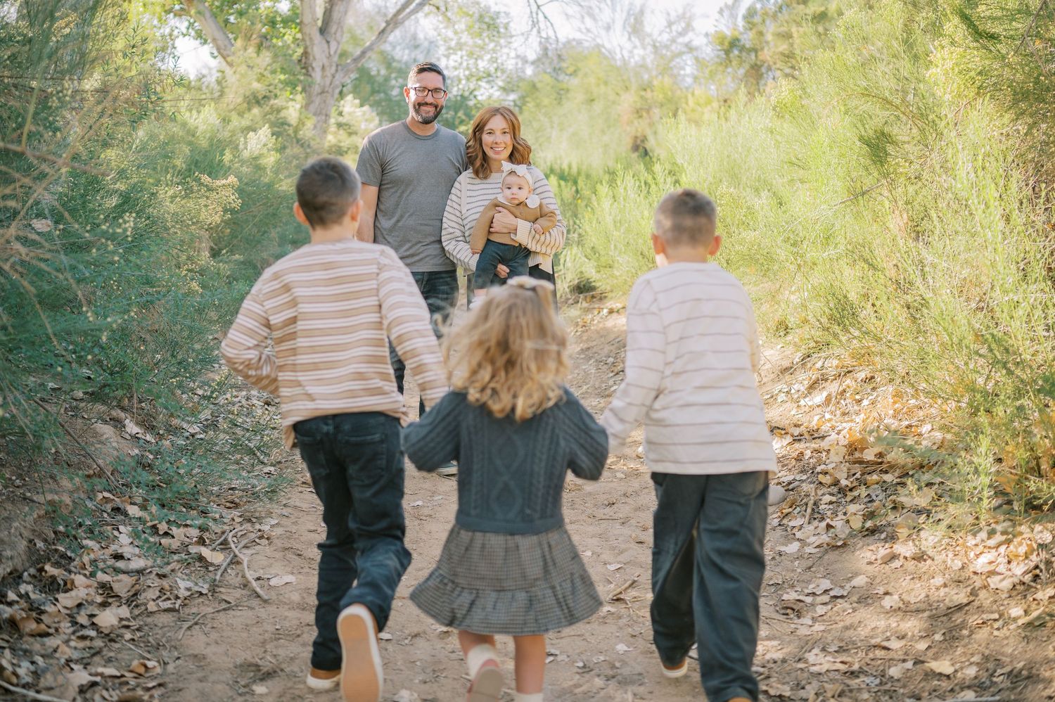 Luxury Gilbert Arizona family photography surrounded by lush greenery. A relaxed, stress-free experience that captures real connection.