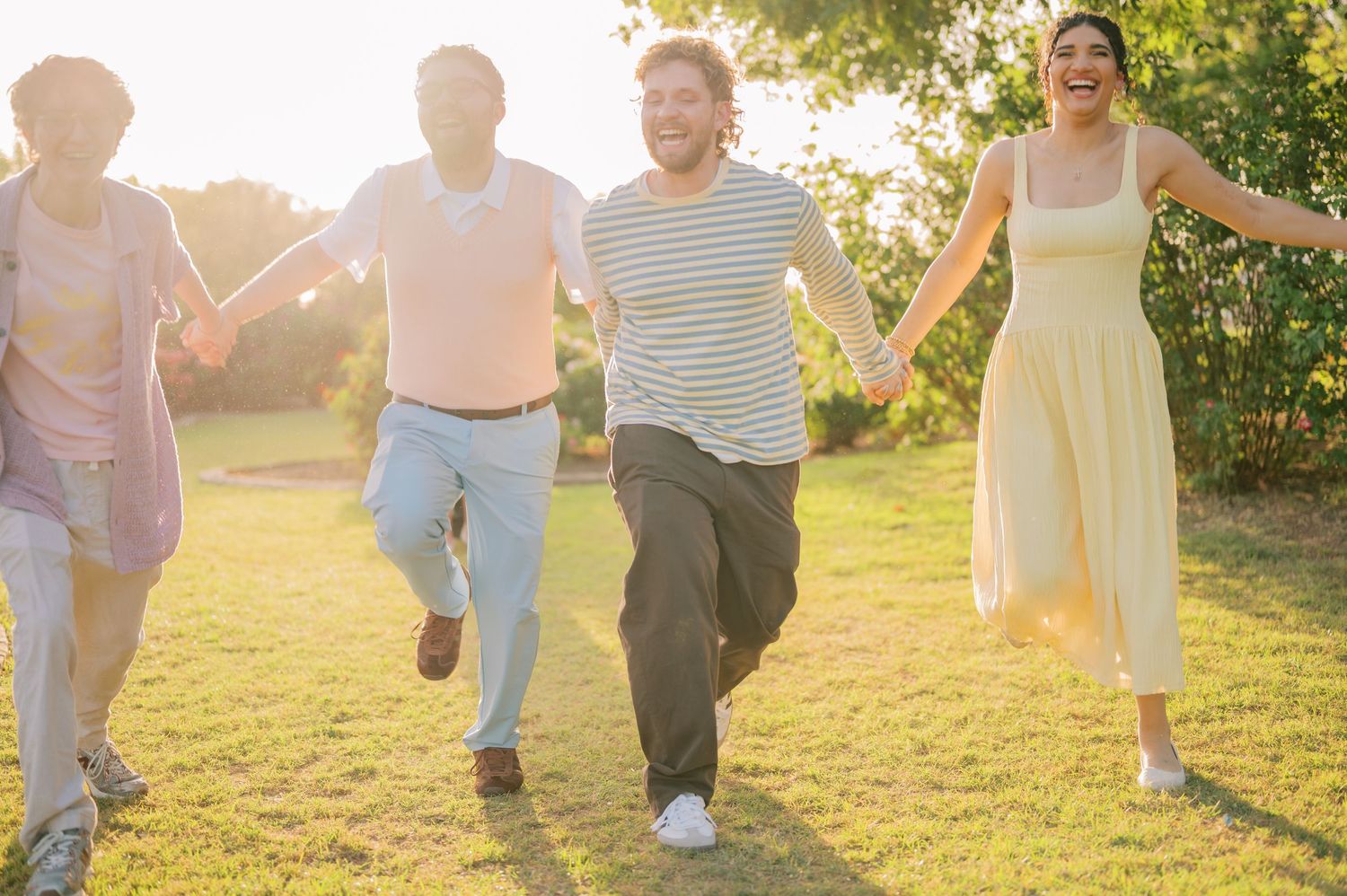Candid extended family moment in a vibrant rose garden landscape