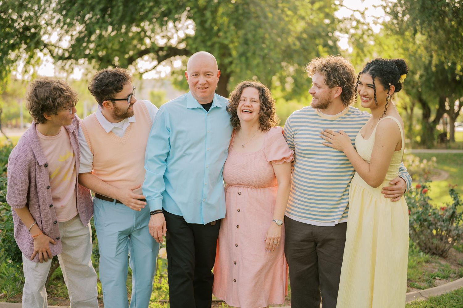 Extended family portrait in a blooming rose garden in Gilbert Arizona