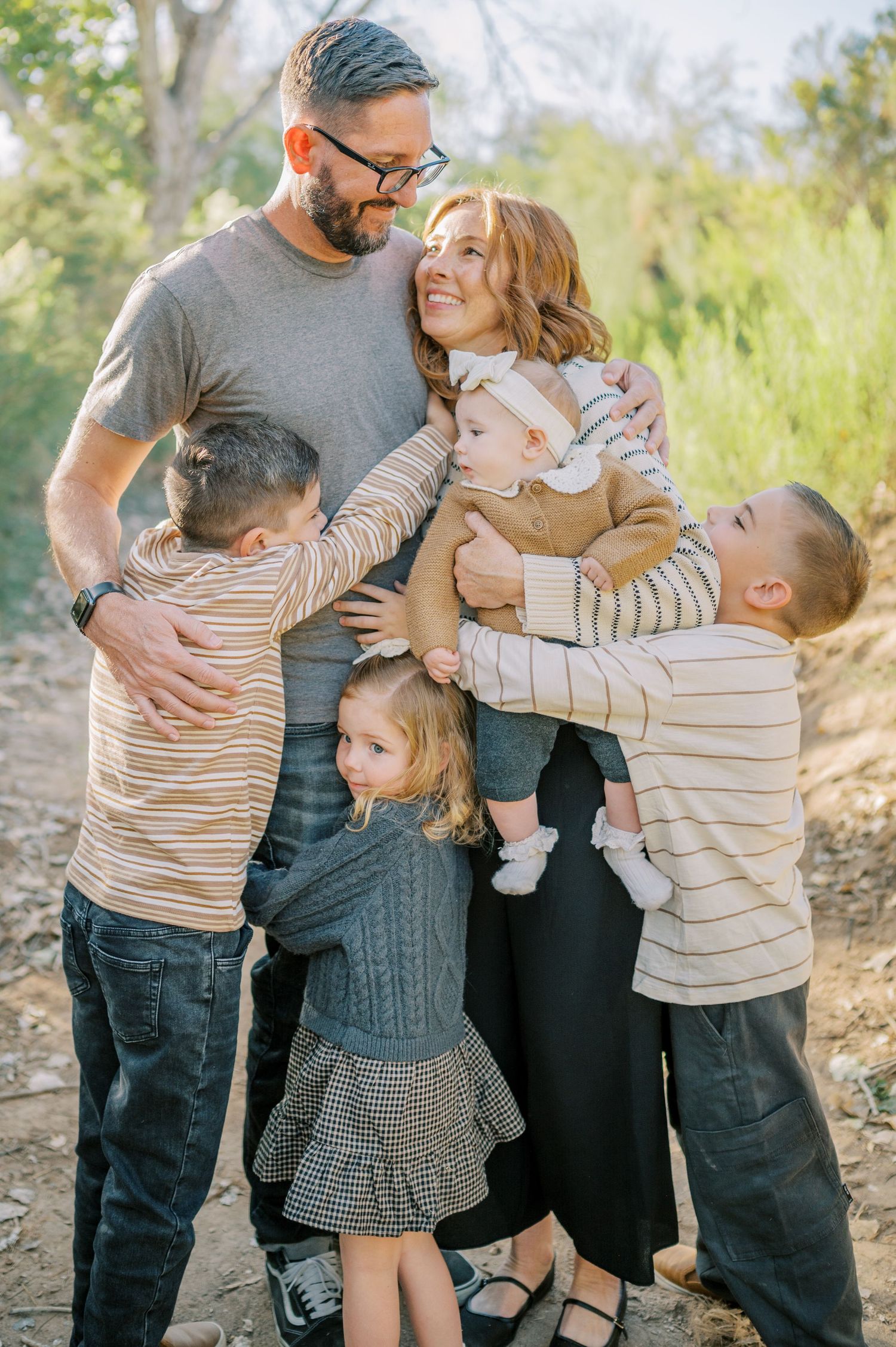Luxury Gilbert Arizona family photography surrounded by lush greenery. A relaxed, stress-free experience that captures real connection.