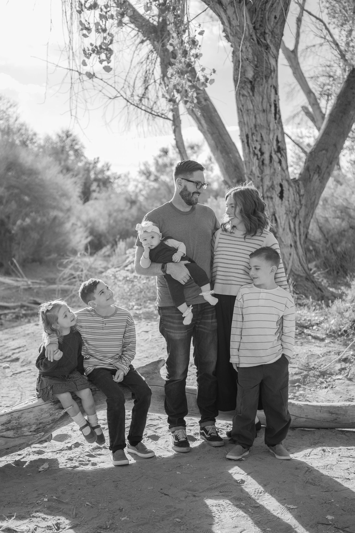 Luxury Gilbert Arizona family photography surrounded by lush greenery. A relaxed, stress-free experience that captures real connection.