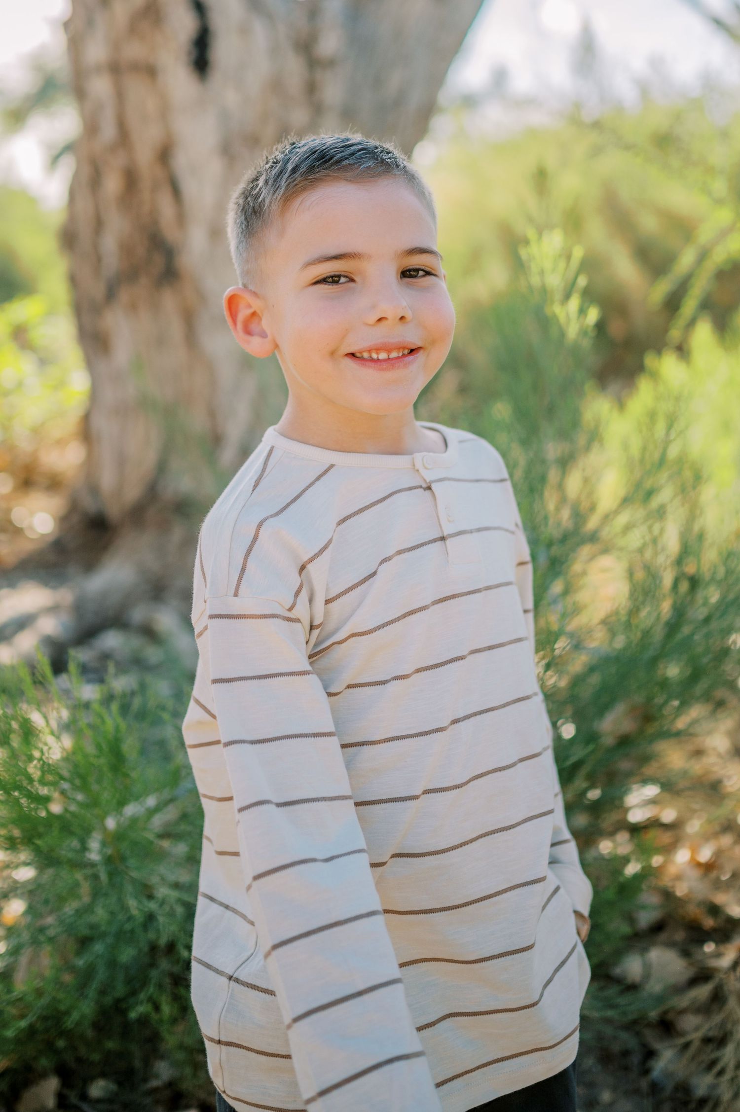 Luxury Gilbert Arizona family photography surrounded by lush greenery. A relaxed, stress-free experience that captures real connection.
