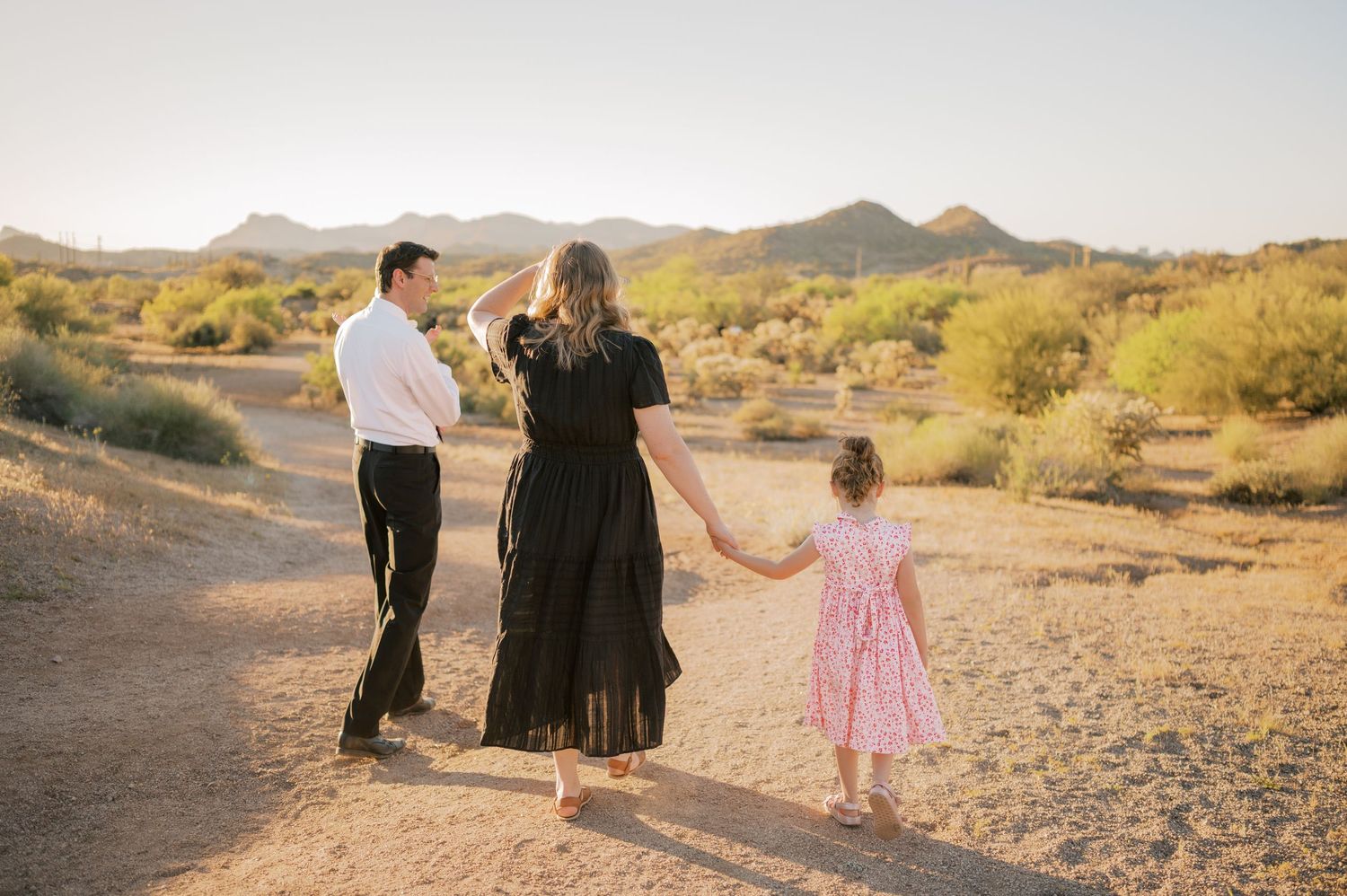 Candid family moment with young children in Gilbert Arizona desert landscape