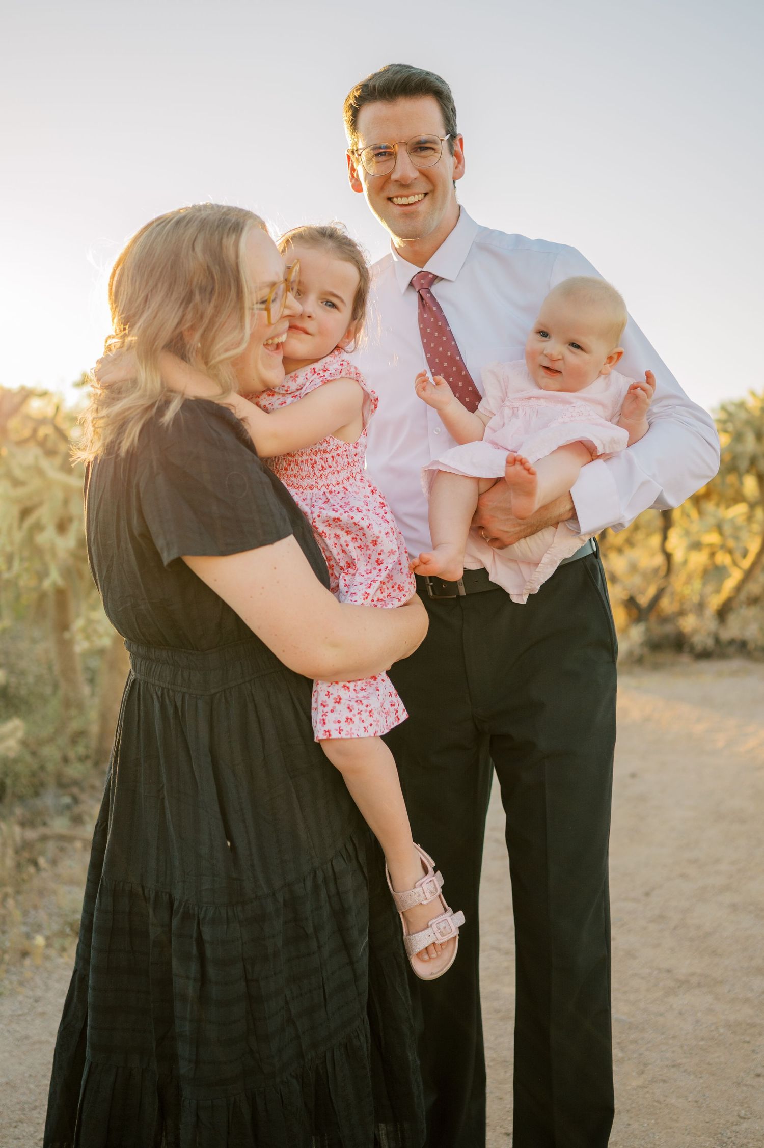 Elegant family portrait in Arizona desert landscape at sunset