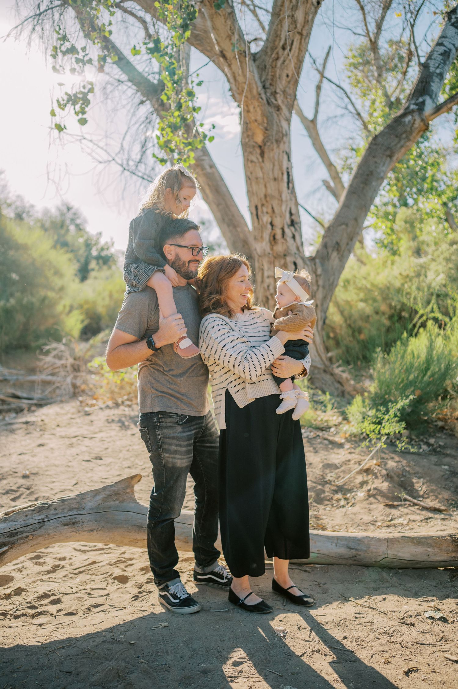 Luxury Gilbert Arizona family photography surrounded by lush greenery. A relaxed, stress-free experience that captures real connection.
